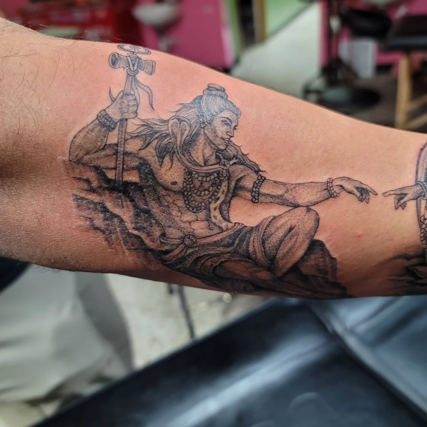Shiva black and grey tattoo on the forearm by Mary Lefeau