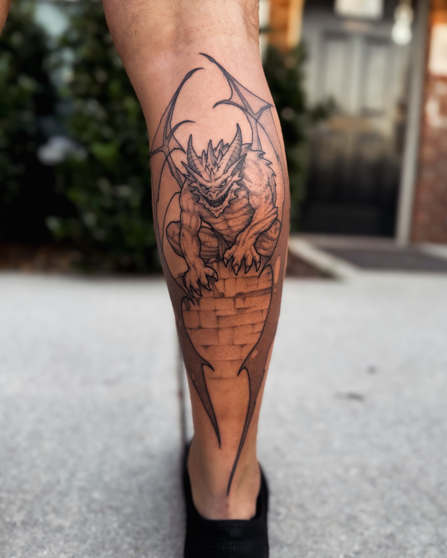Dragon black and grey tattoo on the calf by 𝔍𝔞𝔯𝔢𝔡 𝔞𝔩𝔩𝔢𝔫