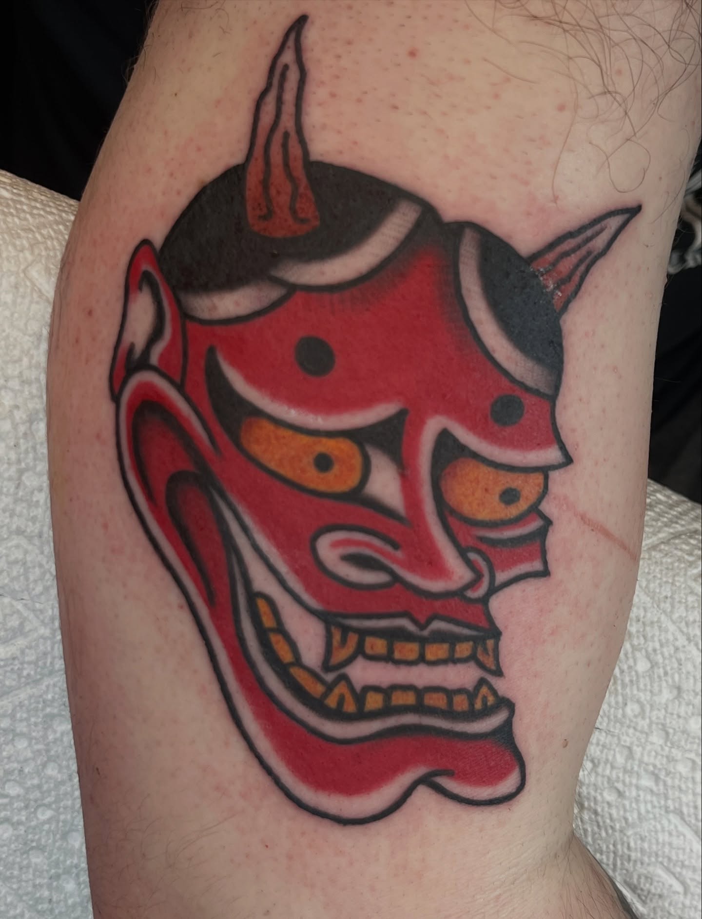 Demon mask japanese irezumi tattoo on the forearm by August B., Renton, Washington