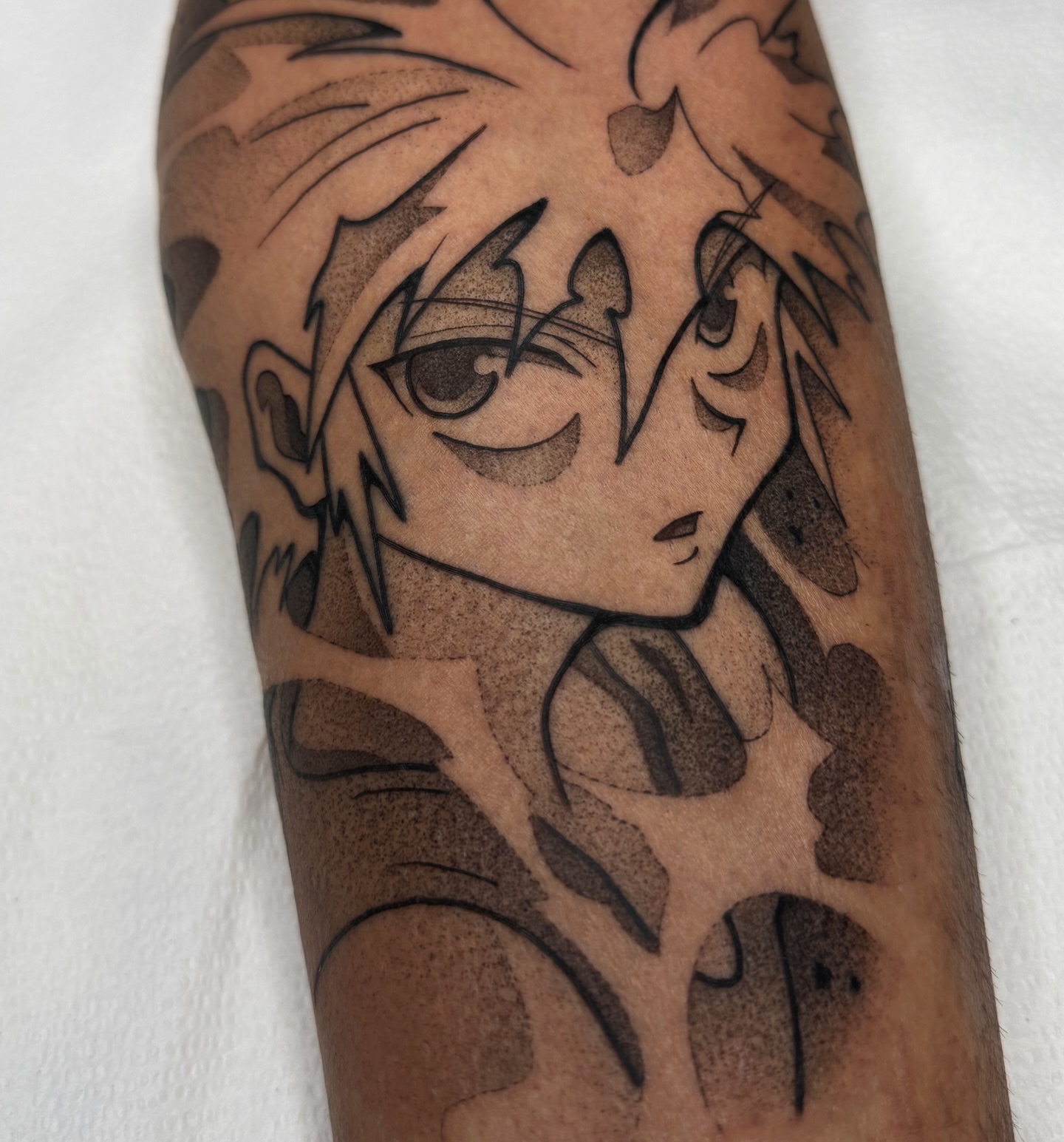 Anime character anime tattoo on the forearm by Z, Greenville, South Carolina