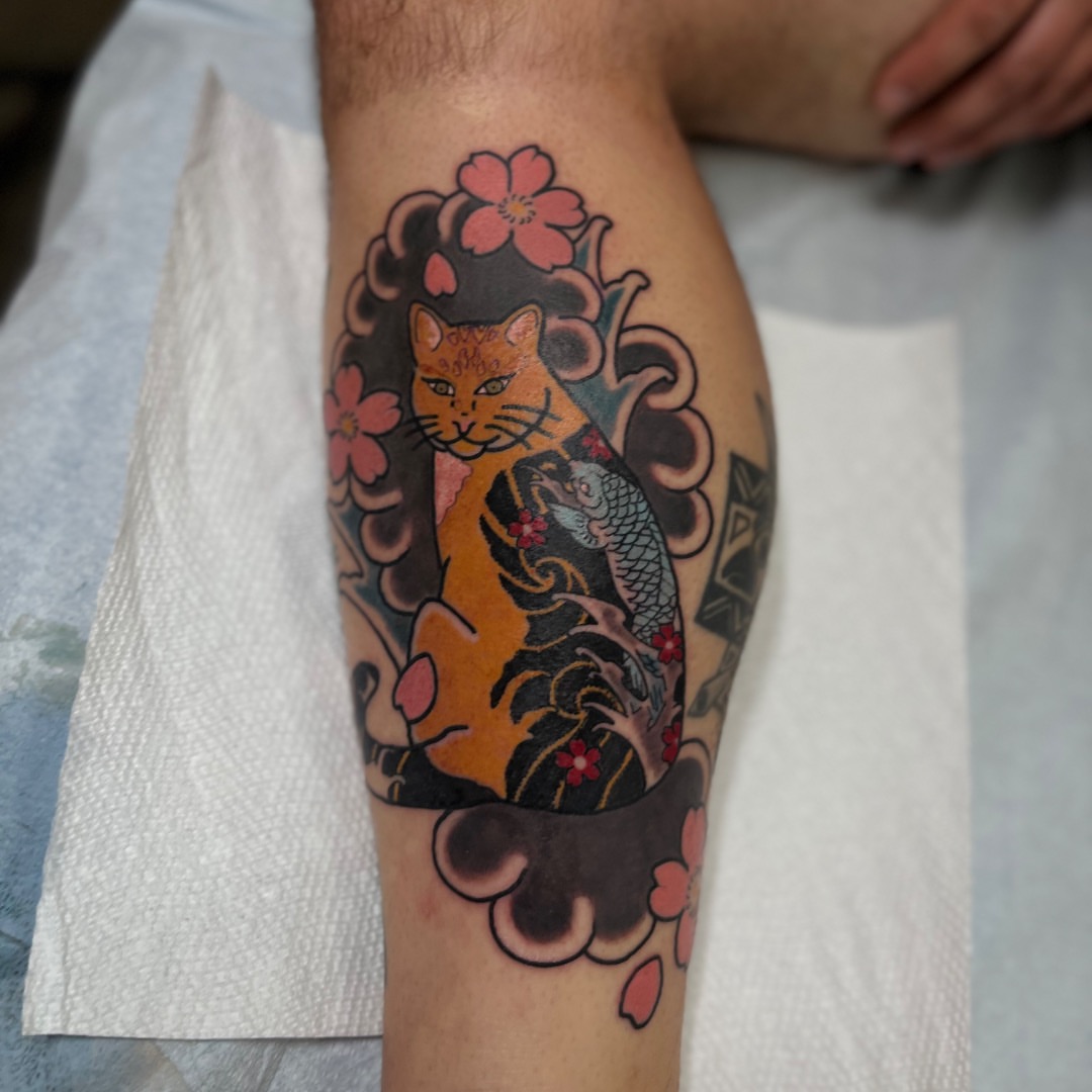 Cat and koi japanese irezumi tattoo on the forearm by Kaichi Fujita, Eugene, Oregon