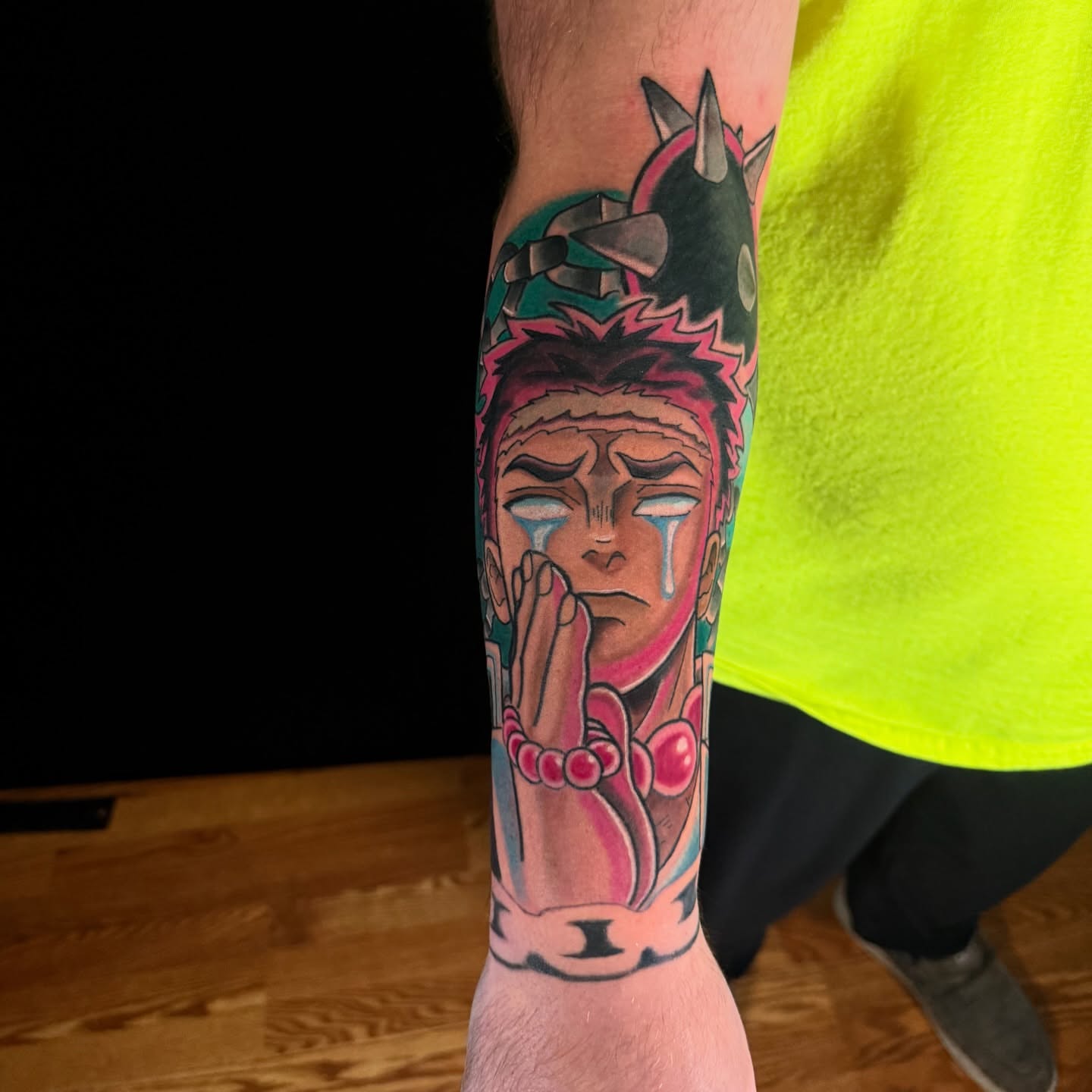 Anime character anime tattoo on the forearm by joshua sides