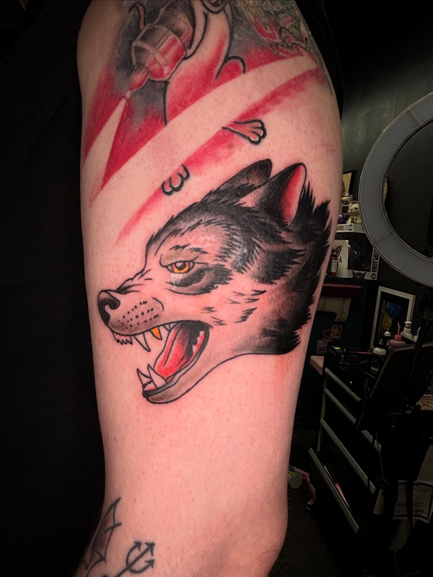 Wolf American traditional tattoo on the forearm by Brett Ferguson