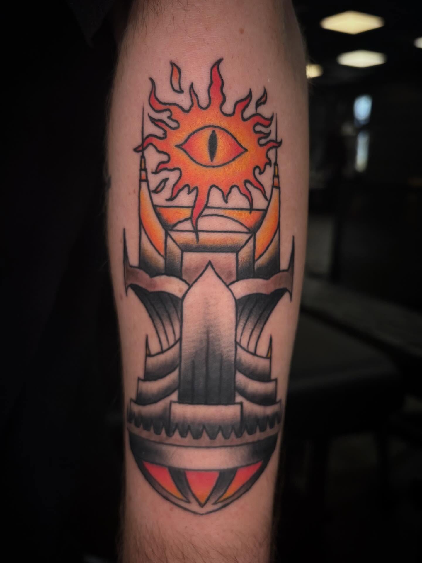 Eye and flame American traditional tattoo on the forearm by Brett Ferguson