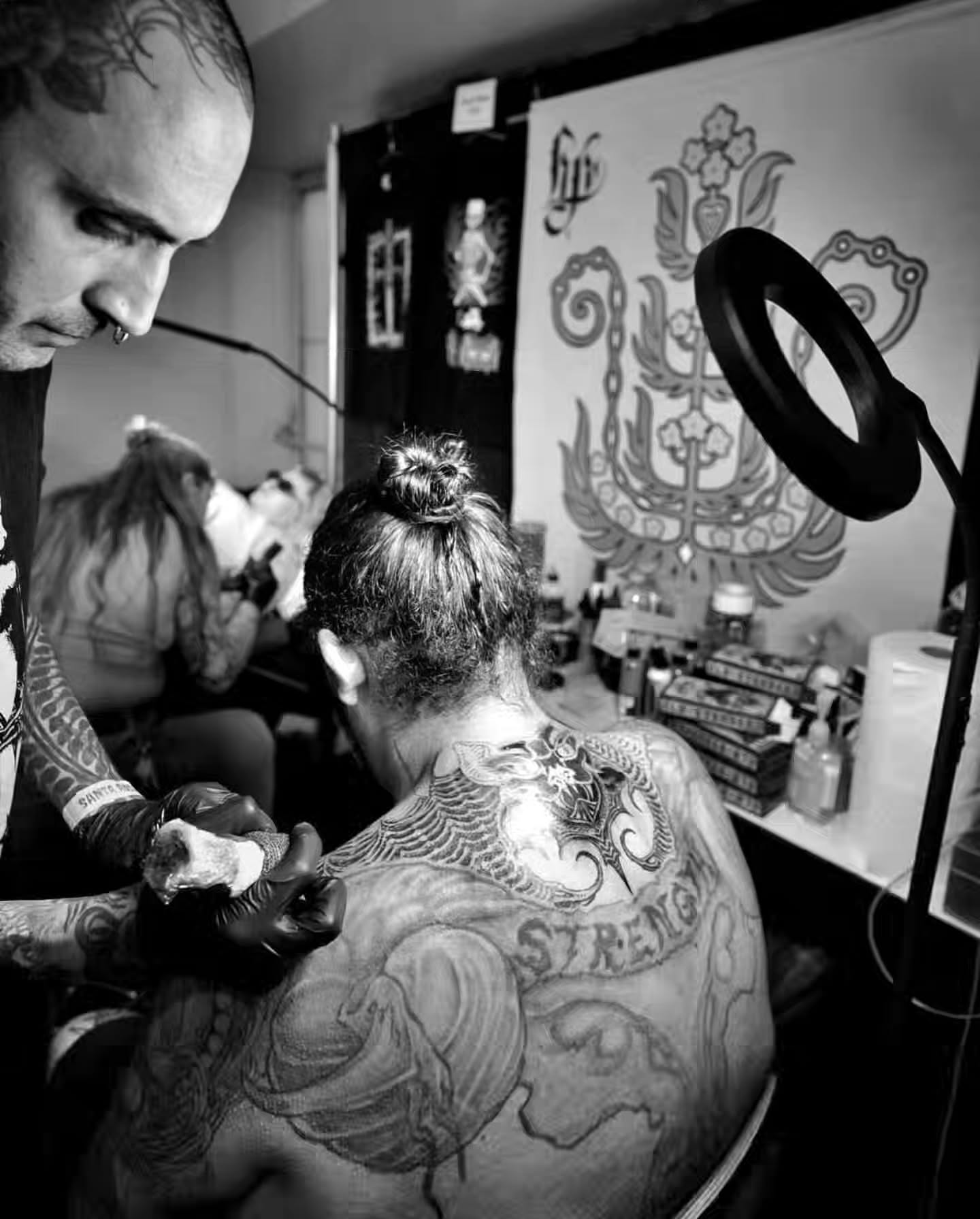 Strength black and grey tattoo on the back by Campbell Zane Alexander