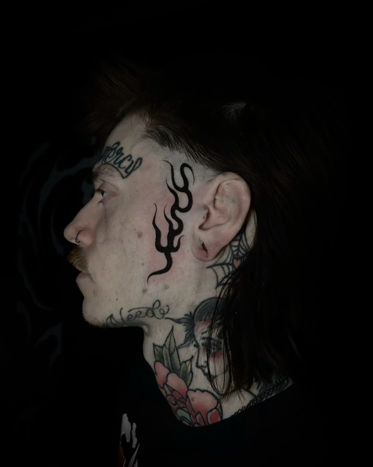 Flame and script black and grey tattoo on the neck by Heaven Arianna