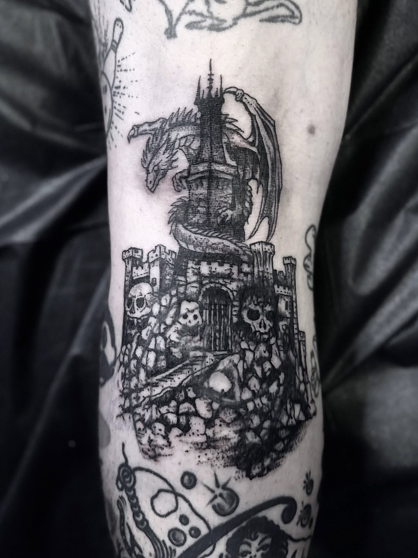 Castle with dragon dotwork tattoo on the forearm by Tattoo Artist, Philadelphia, Pennsylvania