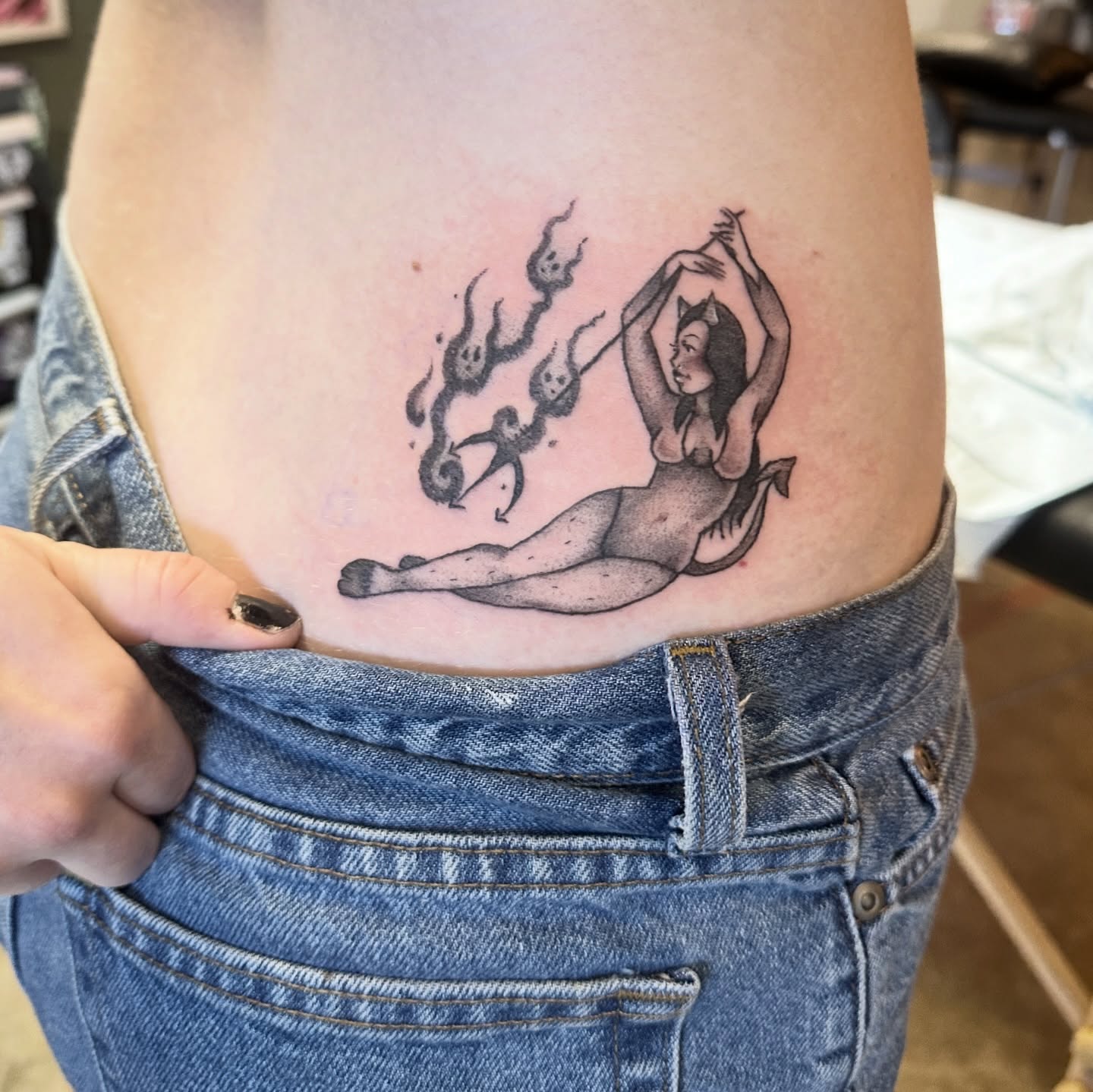 Woman with fire black and grey tattoo on the ribs by Luisa Gonzalez, Austin, Texas