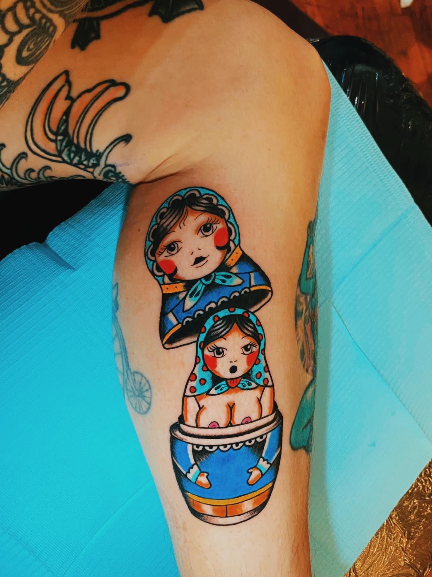 Matryoshka dolls illustrative tattoo on the forearm by Tommy O'Connell