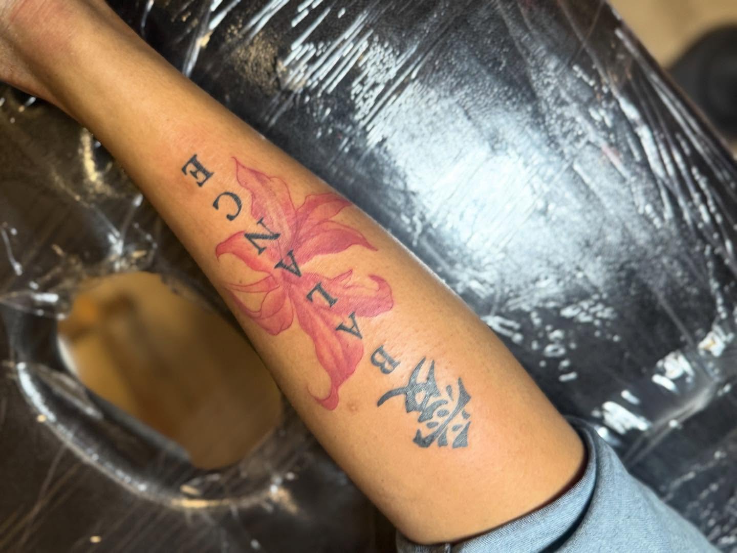 Lotus flower neo-traditional tattoo on the forearm by Gabe