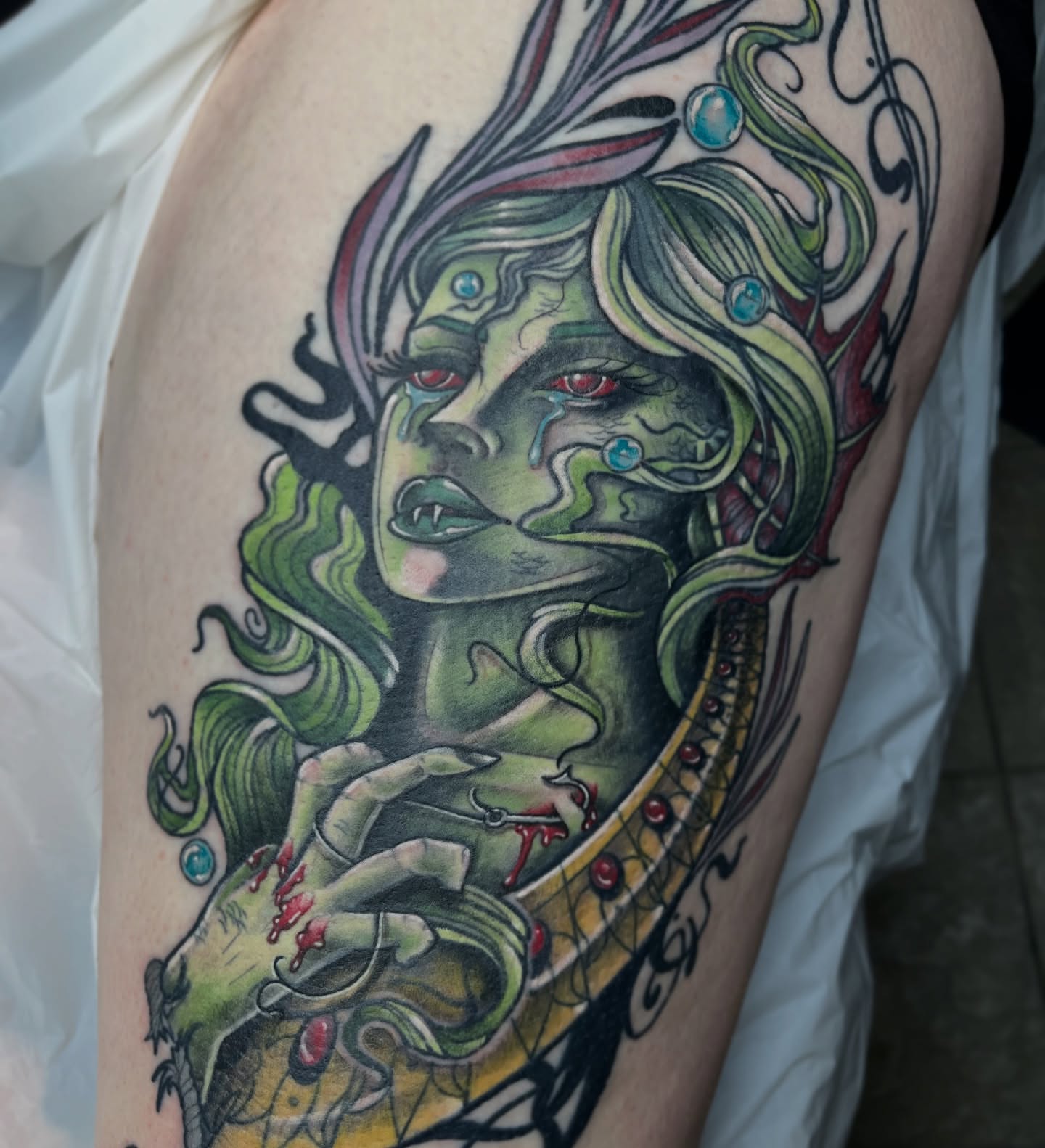 Woman with green hair dark realism tattoo on the thigh by Michigan Tattoo Artist - Nadia Garver, Clinton Township, Michigan