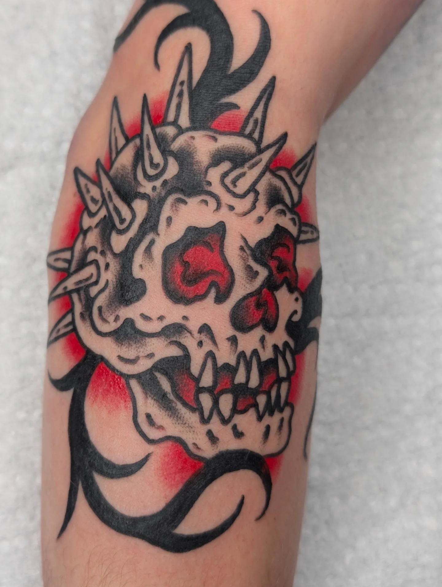 Skull American traditional tattoo on the forearm by Aiden Krone, San Diego, California
