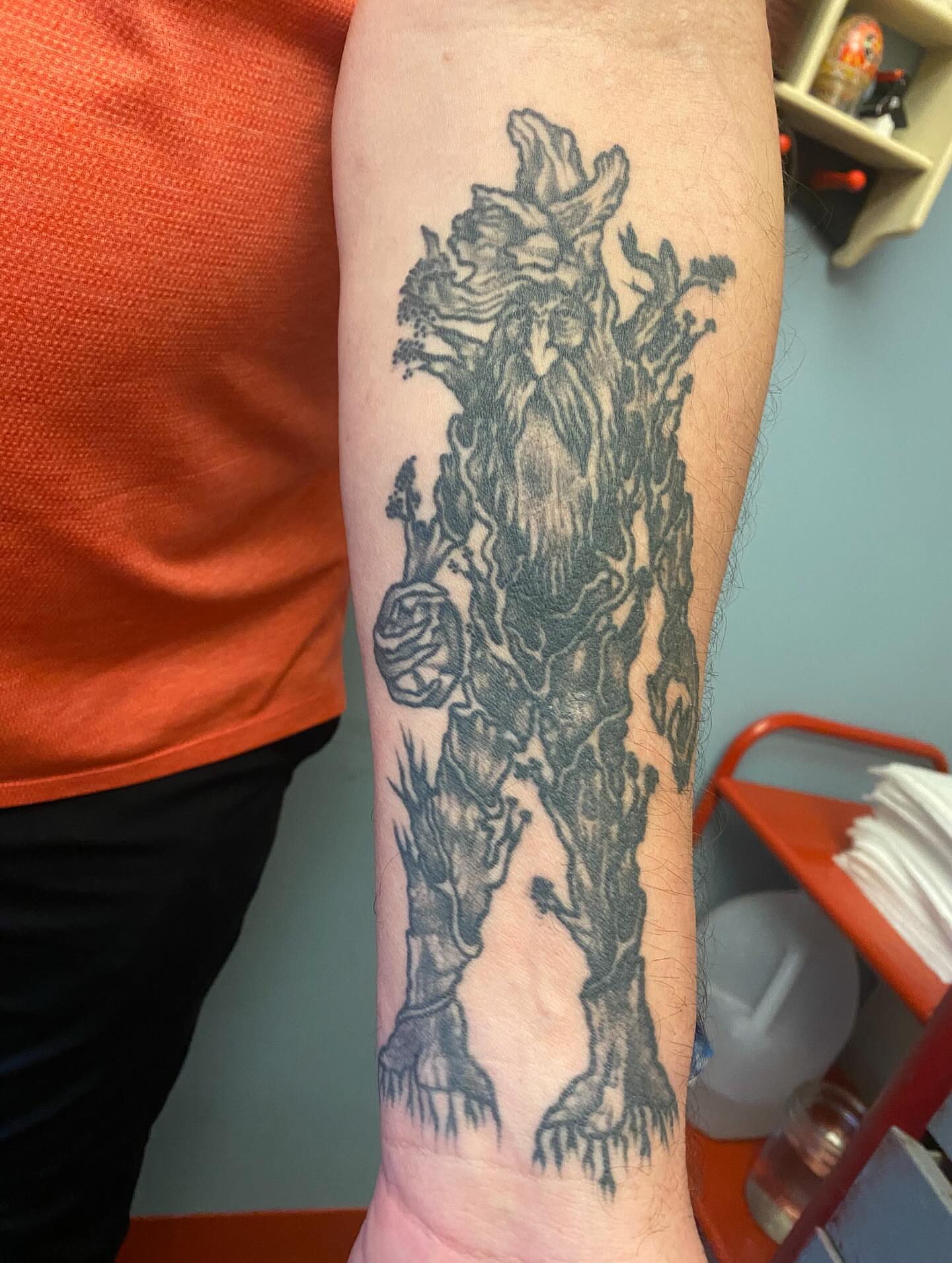 Tree-like creature black and grey tattoo on the forearm by Abby Rose Estes