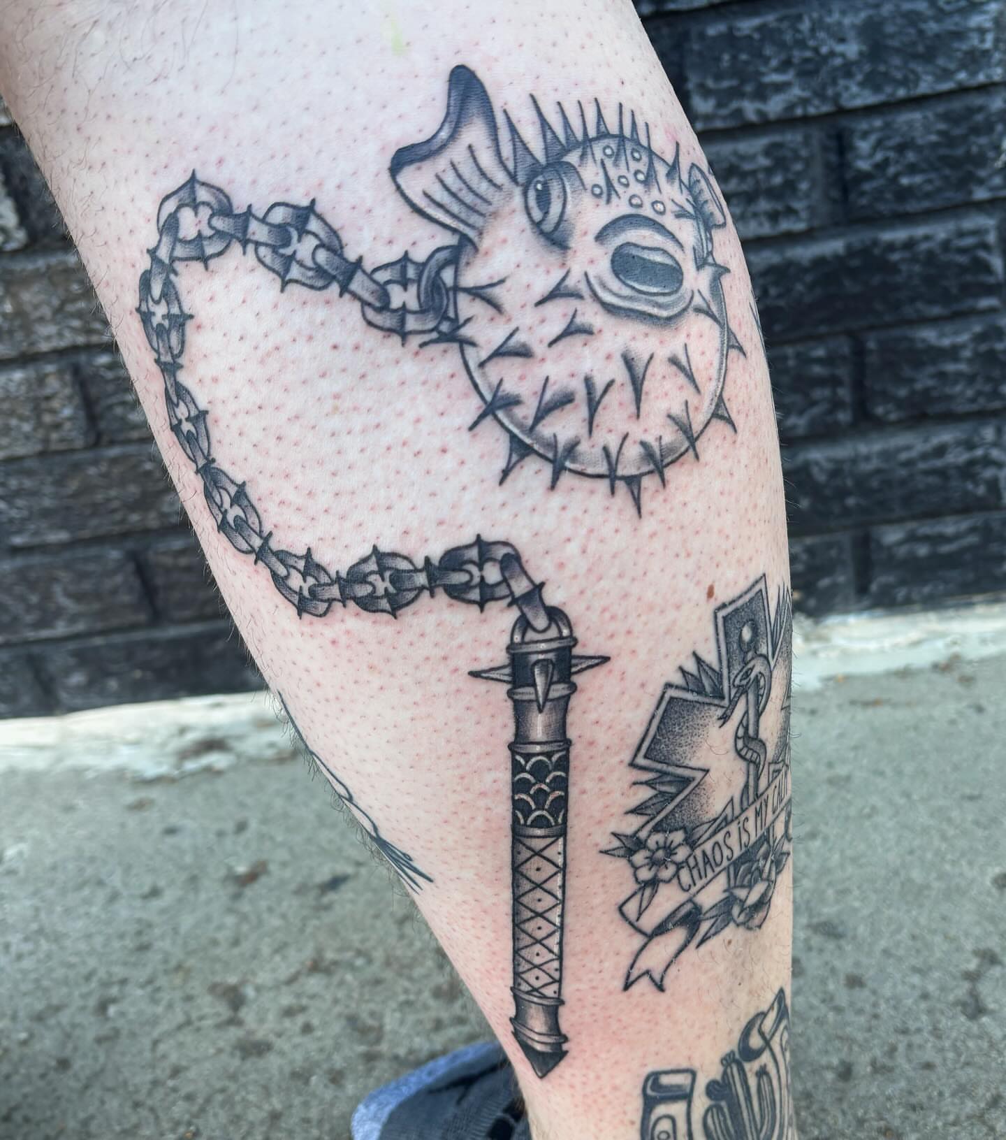 Pufferfish and chain dotwork tattoo on the thigh by Demi Flores 🖤