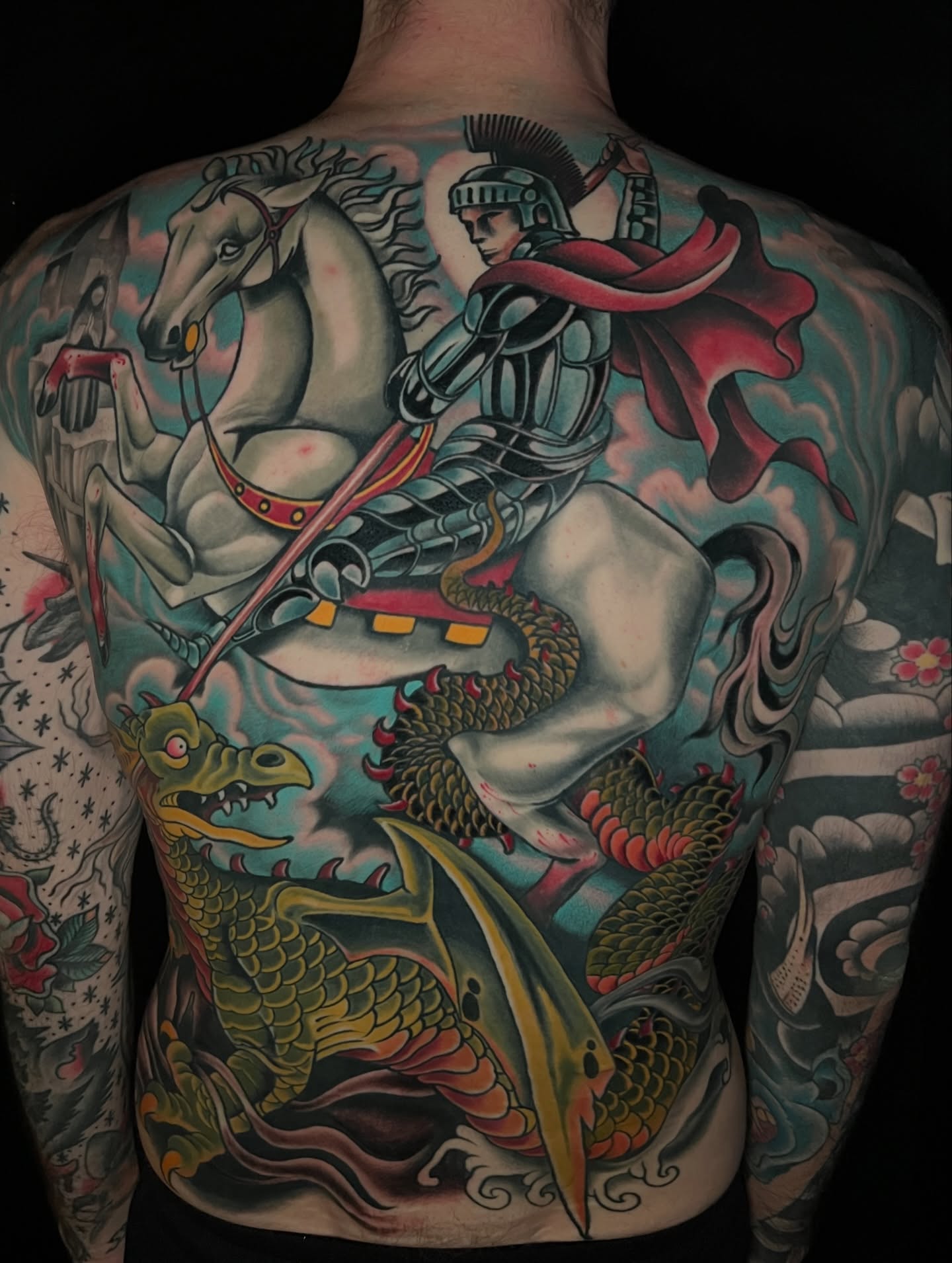 Knight slaying dragon American traditional tattoo on the back by JoshUA Bowers, Des Moines, Iowa