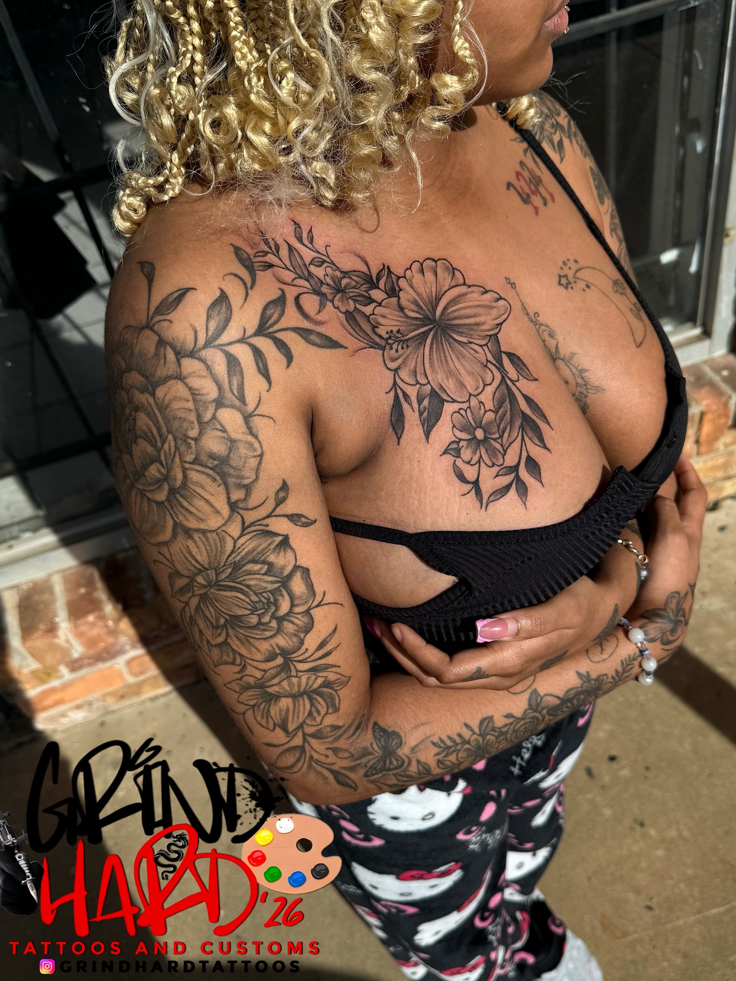 Floral bouquet black and grey tattoo on the chest by GrindHard Quen