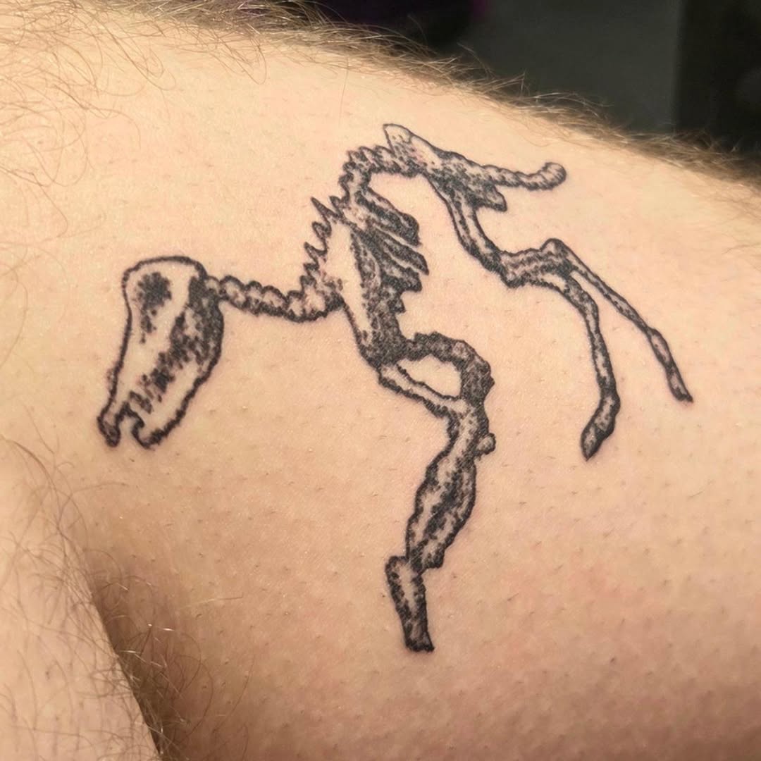 Horse skeleton sketch tattoo on the upper arm by π«