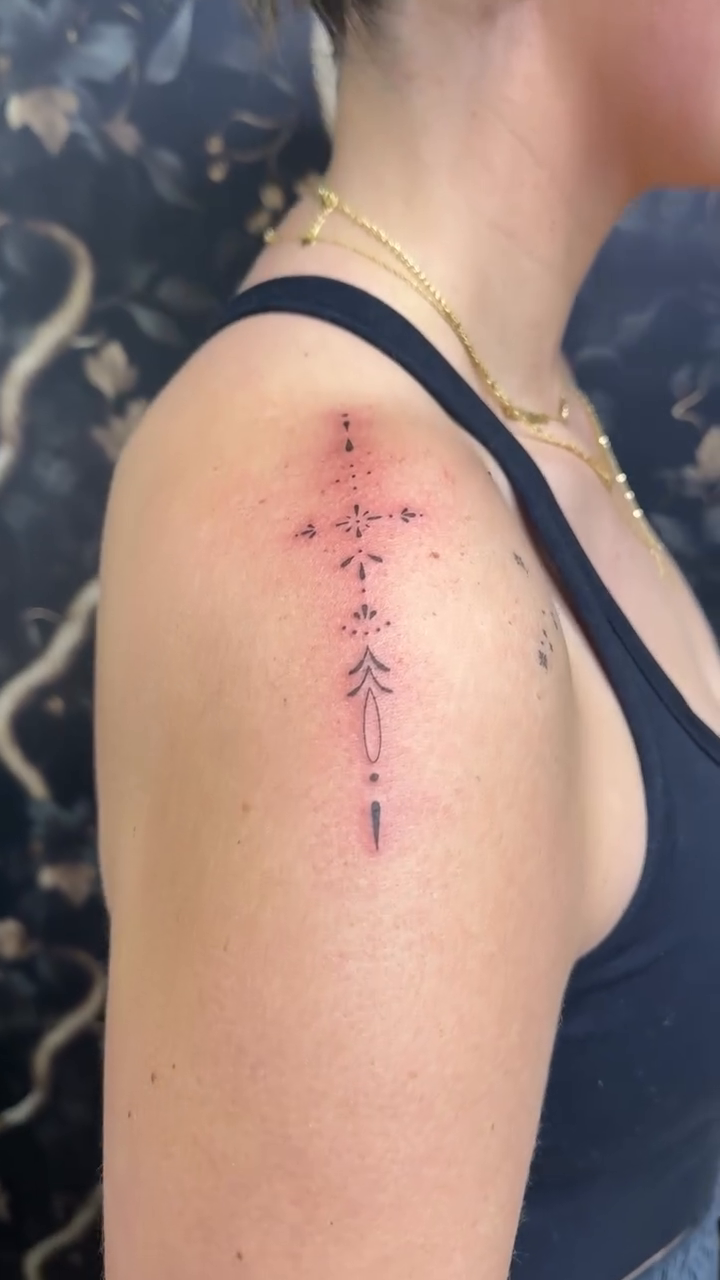 Geometric constellation and wave ornamental tattoo on the upper arm by Fineline Tattoos π€ Hailey L.