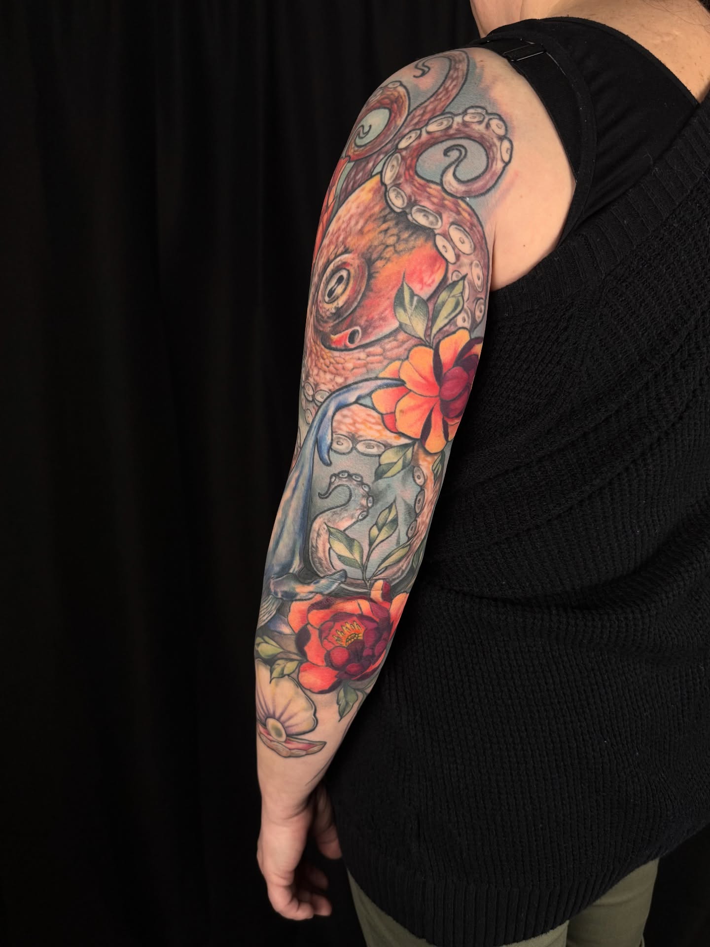 Octopus and flowers new school tattoo on the forearm by Sam Minter, Grafton, Massachusetts