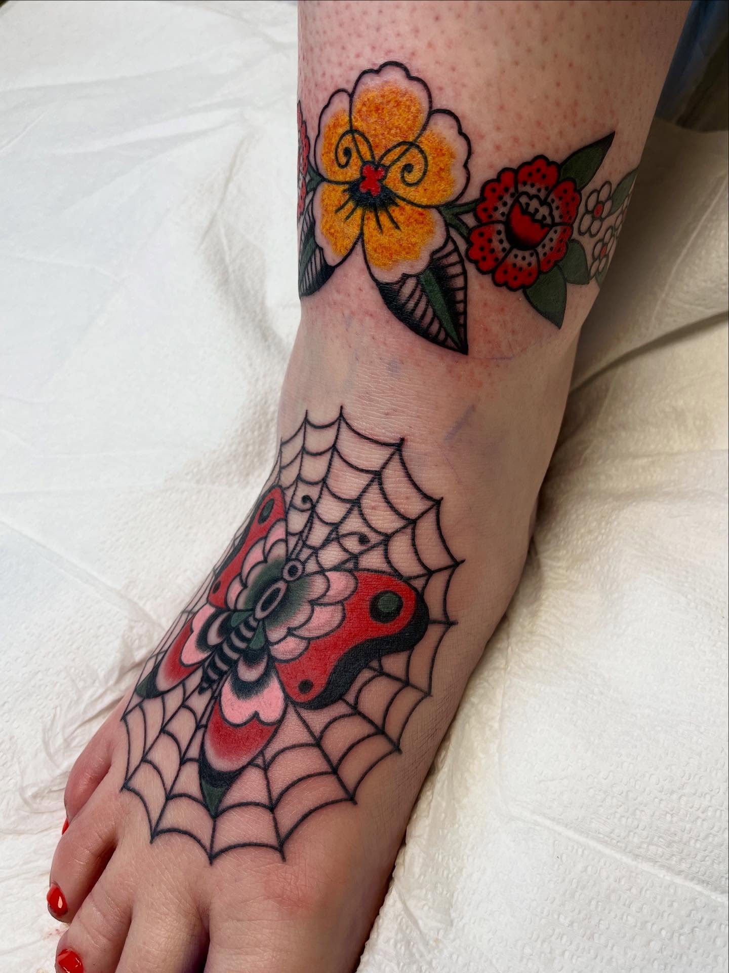 Butterfly and spiderweb American traditional tattoo on the foot by 🌞all Bodies Welcome🌞