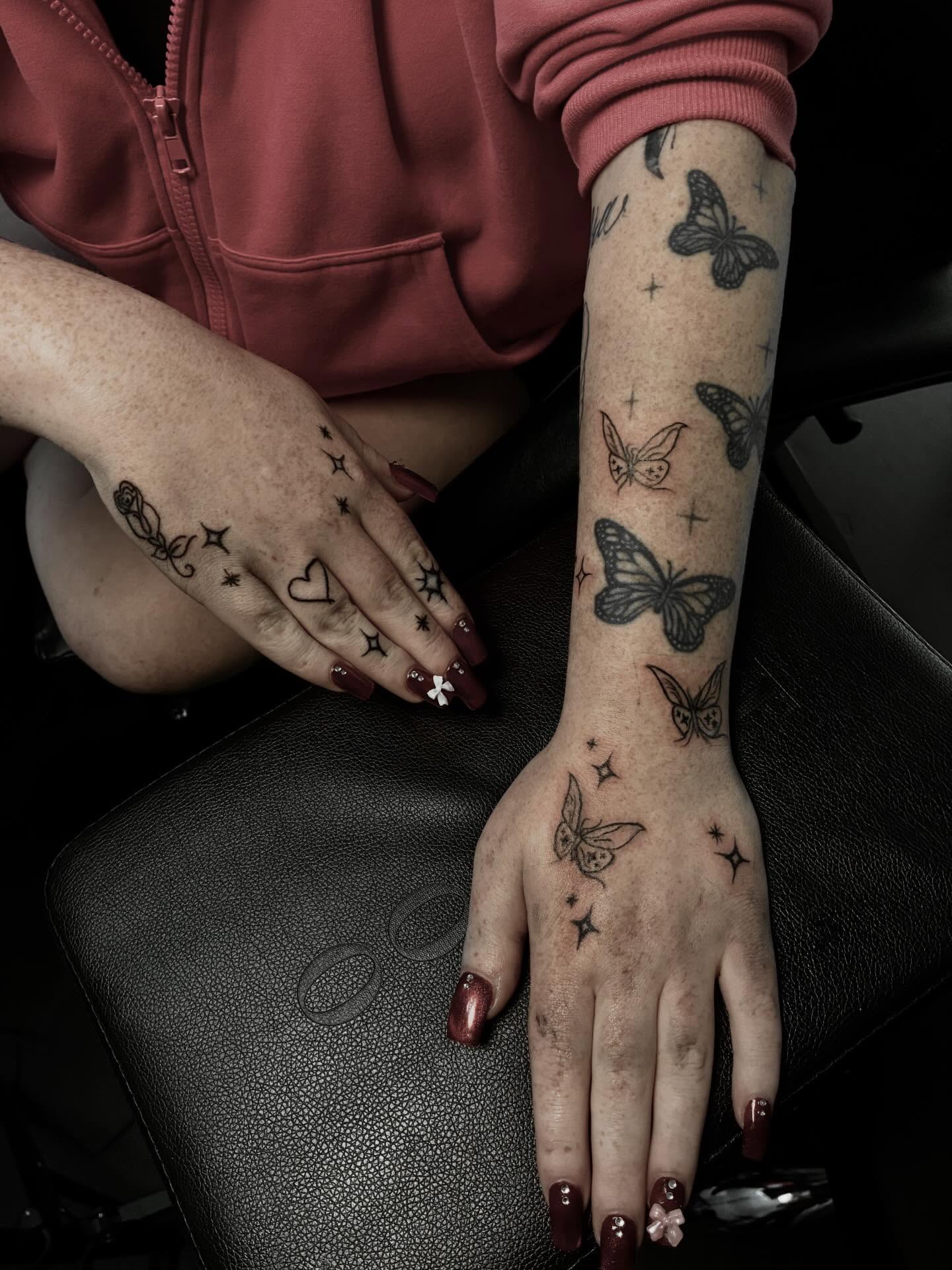 Butterflies and stars black and grey tattoo on the upper arm by Ink’d by Reina 🖤, Colorado Springs, Colorado