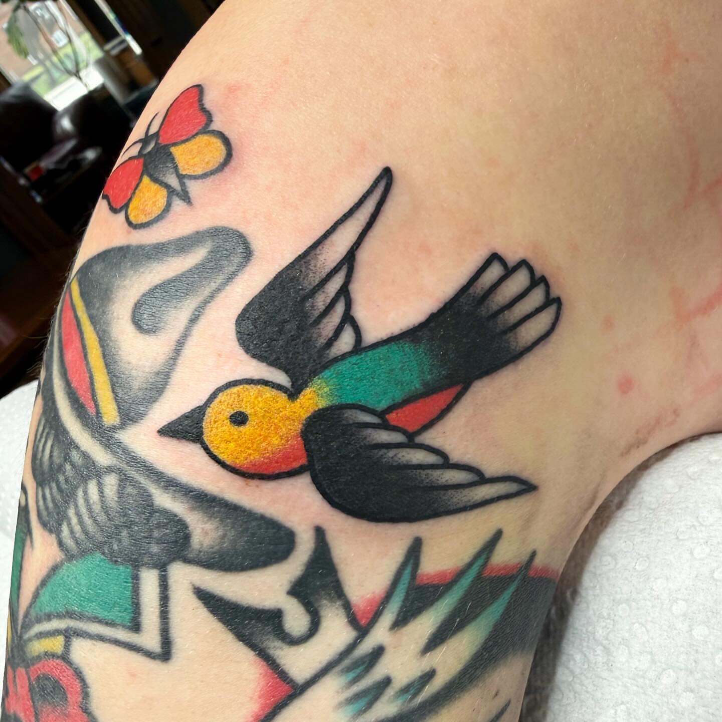 Bird American traditional tattoo on the upper arm by ༺tessa༻