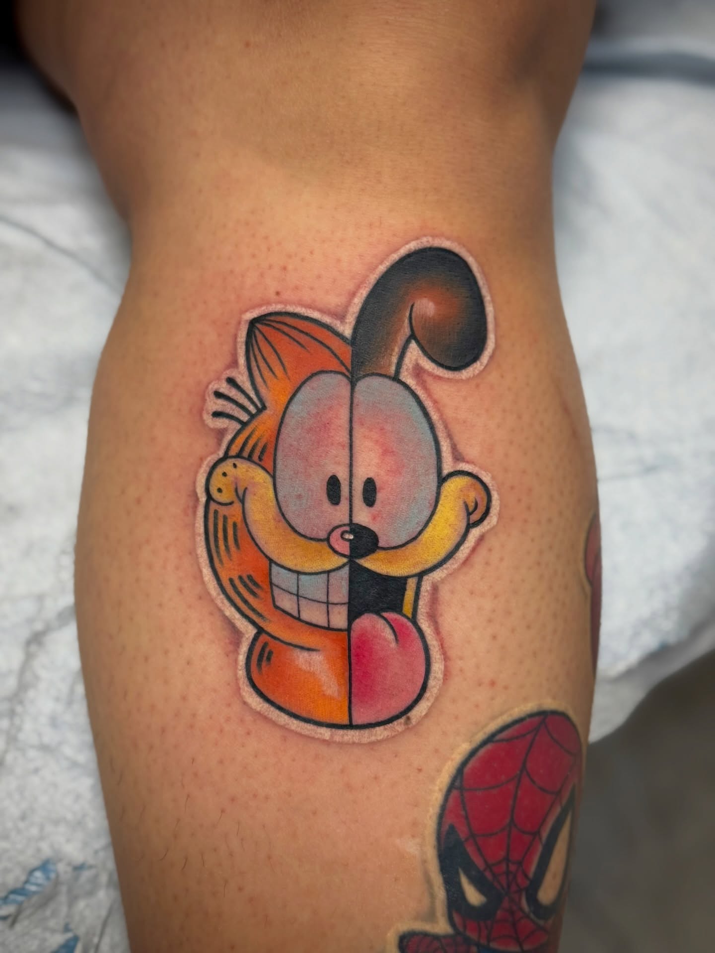 Garfield American traditional tattoo on the thigh by Donovan hernandez