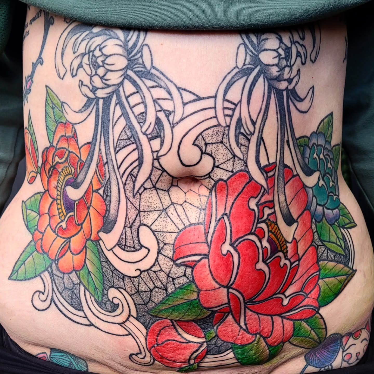 Peony flowers American traditional tattoo on the torso by Ashley Thomas, Midvale, Utah