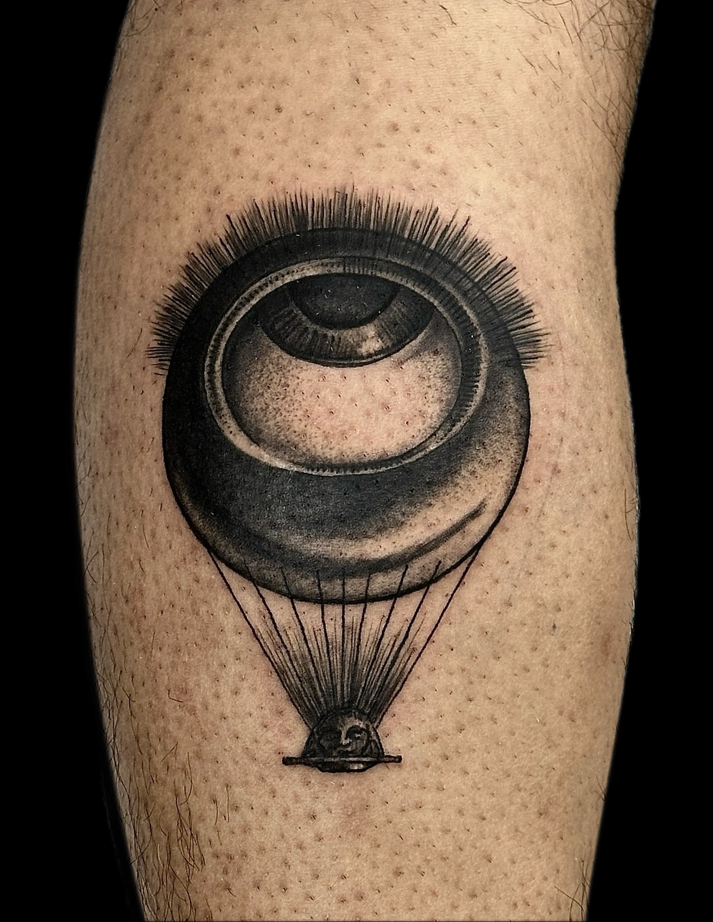 Eye balloon realism tattoo on the forearm by Madeline Brown