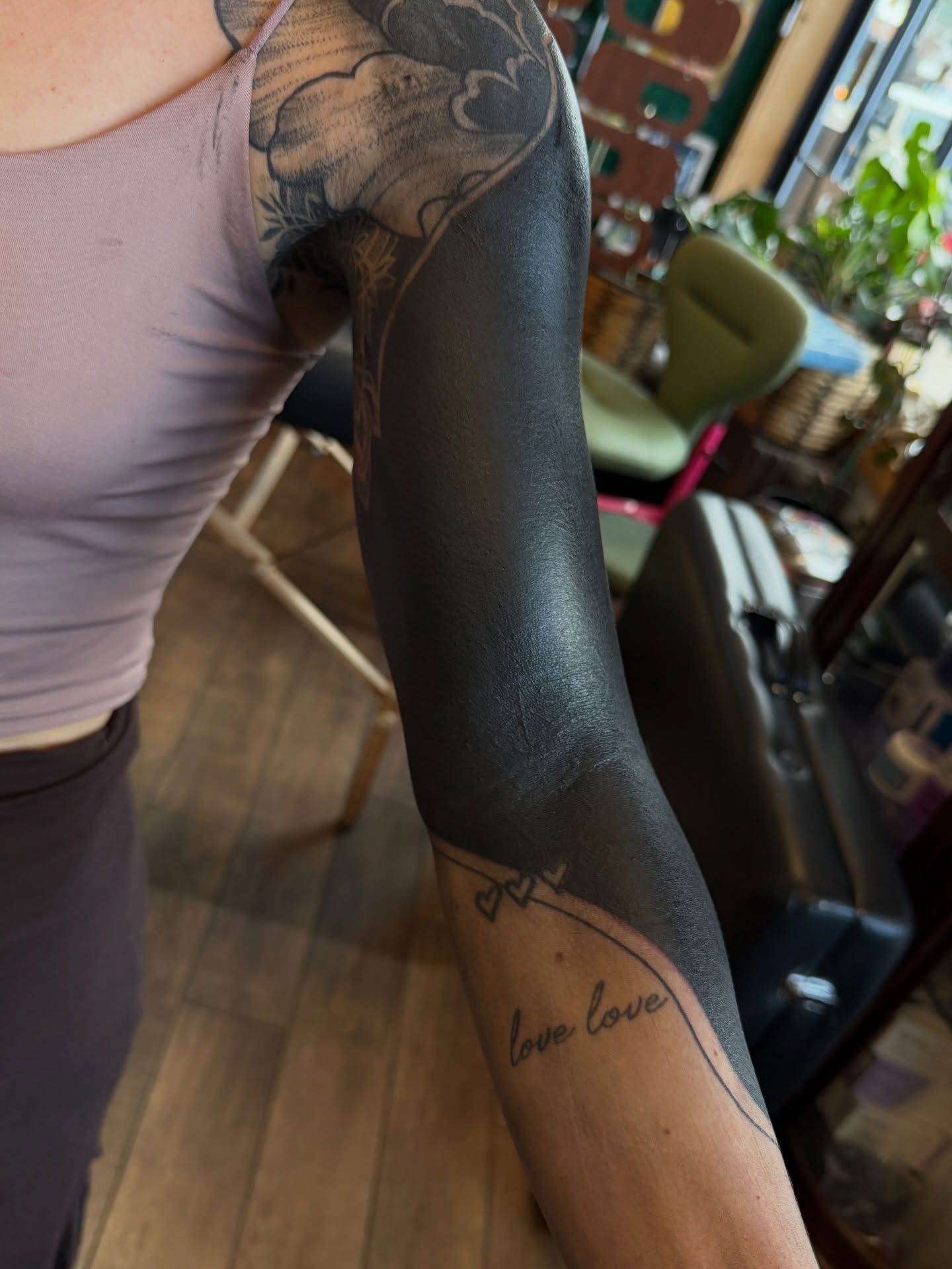 Flower black and grey tattoo on the forearm by Denver Blackout Tattoo Specialist - Anthony