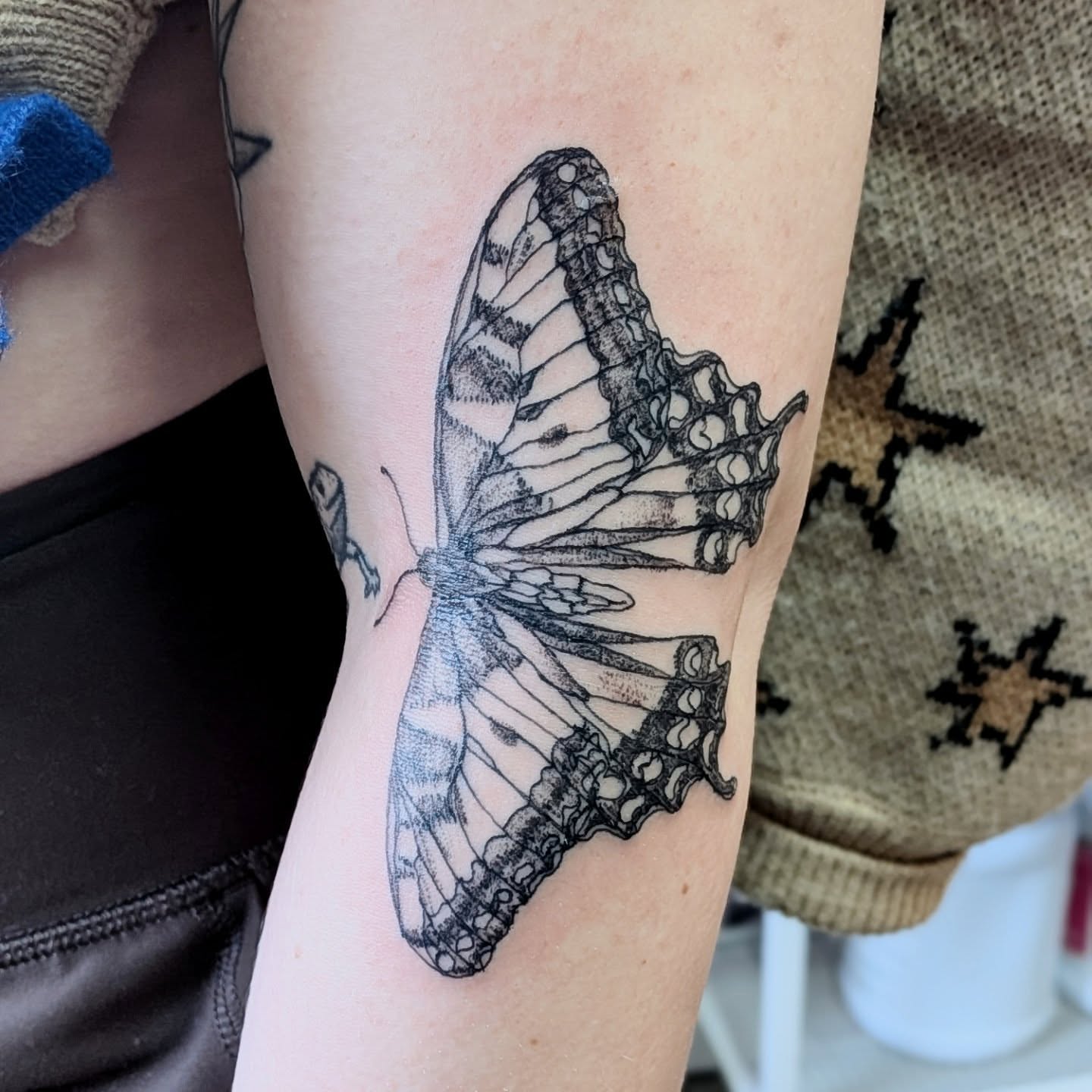 Butterfly black and grey tattoo on the forearm by Ryan