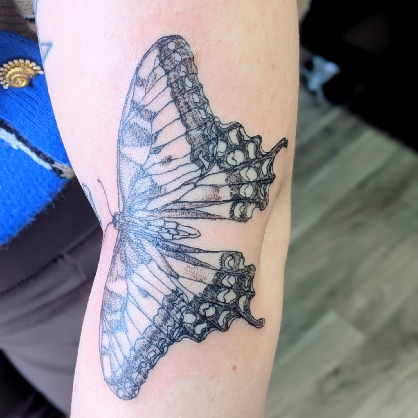 Butterfly black and grey tattoo on the forearm by Ryan