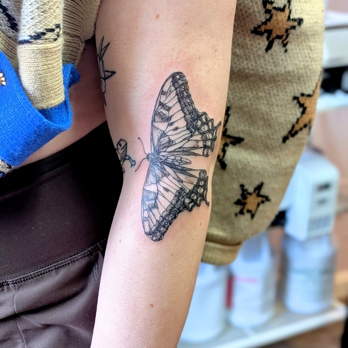 Butterfly black and grey tattoo on the forearm by Ryan