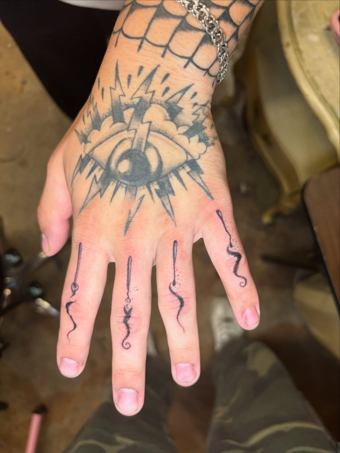 Eye with lightning bolts black and grey tattoo on the hand by Jojo Rose ✨ Denver Tattoo Artist