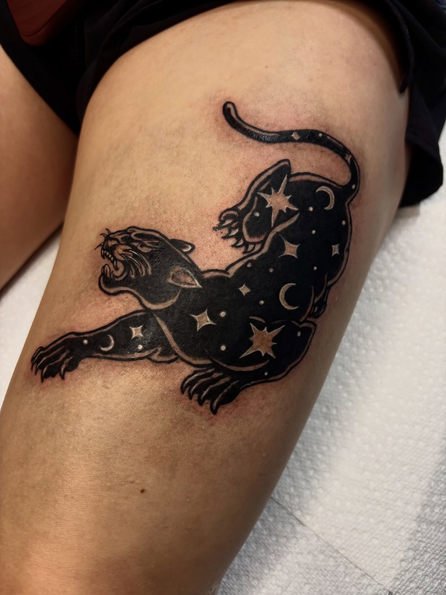 Panther and celestial elements dark realism tattoo on the thigh by Nashville Tattoo Artist