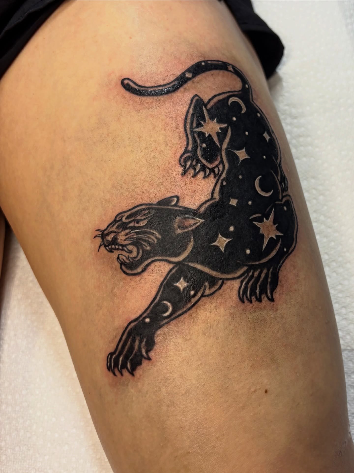 Panther black and grey tattoo on the thigh by Nashville Tattoo Artist
