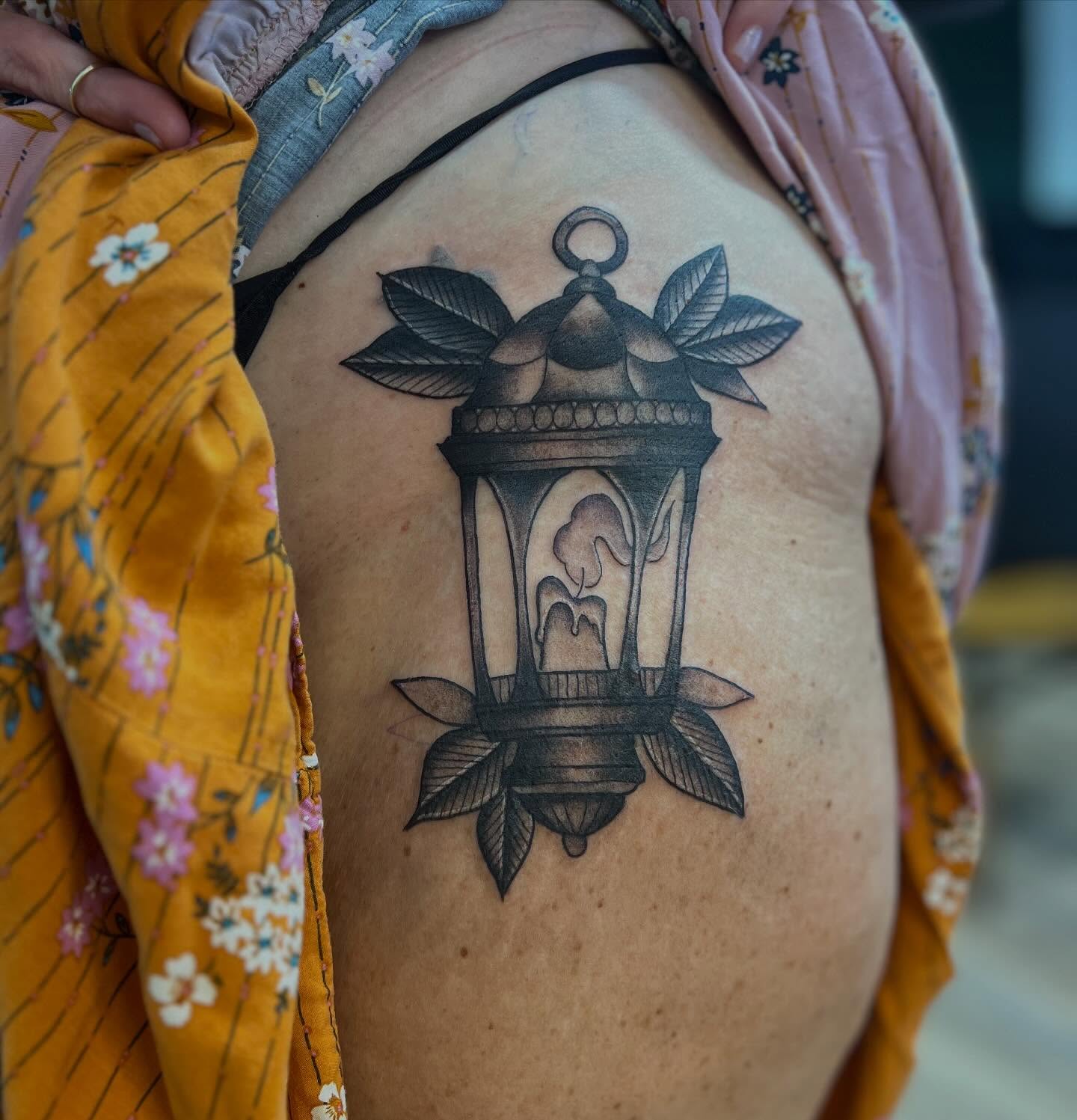 Lantern black and grey tattoo on the thigh by Victorian Coleman