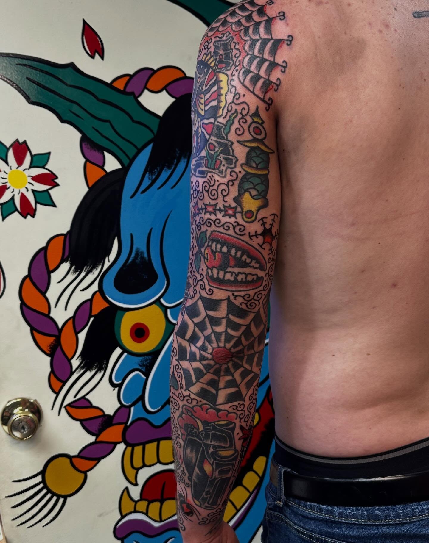 Japanese irezumi American traditional tattoo on the upper arm by Rob, Nashville, Tennessee