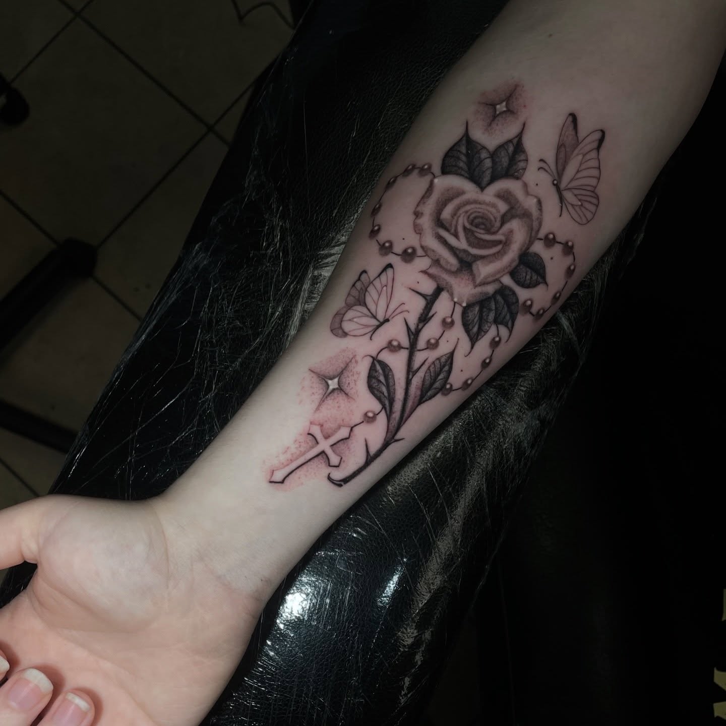 Rose and butterflies black and grey tattoo on the forearm by Shadoww Espinoza