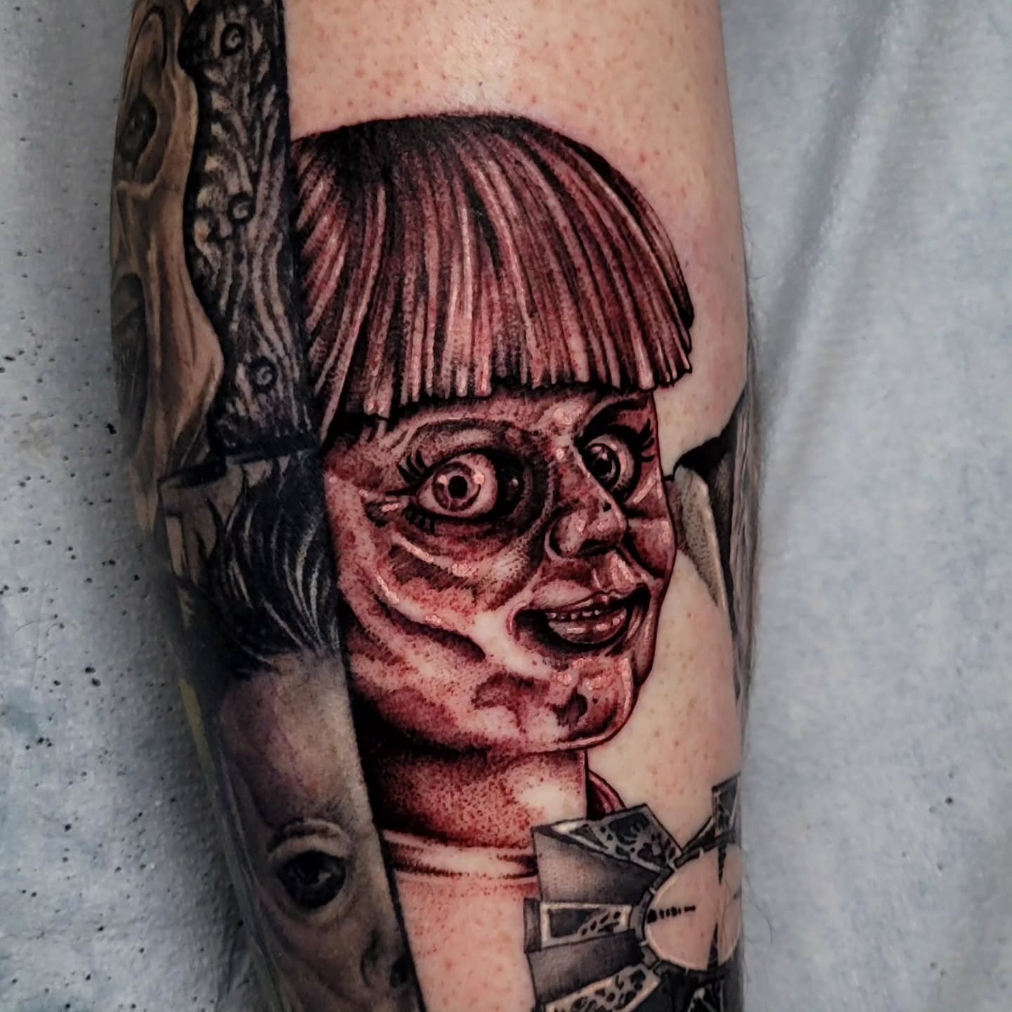 Child's face realism tattoo on the forearm by Tyler Monty