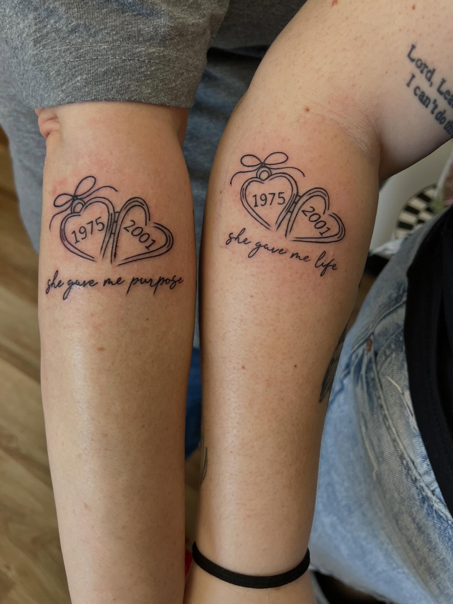 Heart and ribbon black and grey tattoo on the forearm by Presley Tattoos, Murfreesboro, Tennessee