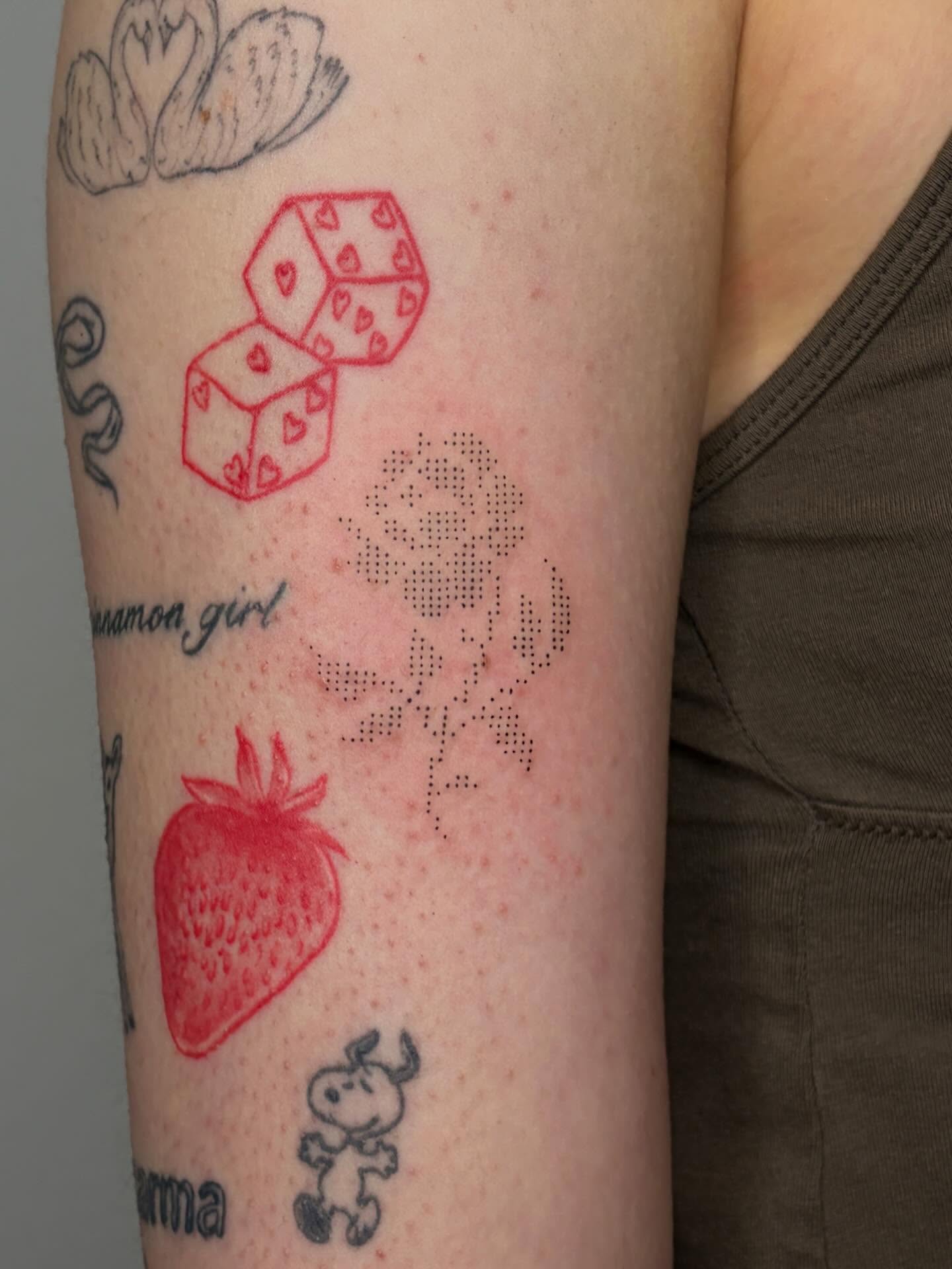 Strawberry and dice dotwork tattoo on the forearm by alyssa doing tattoos