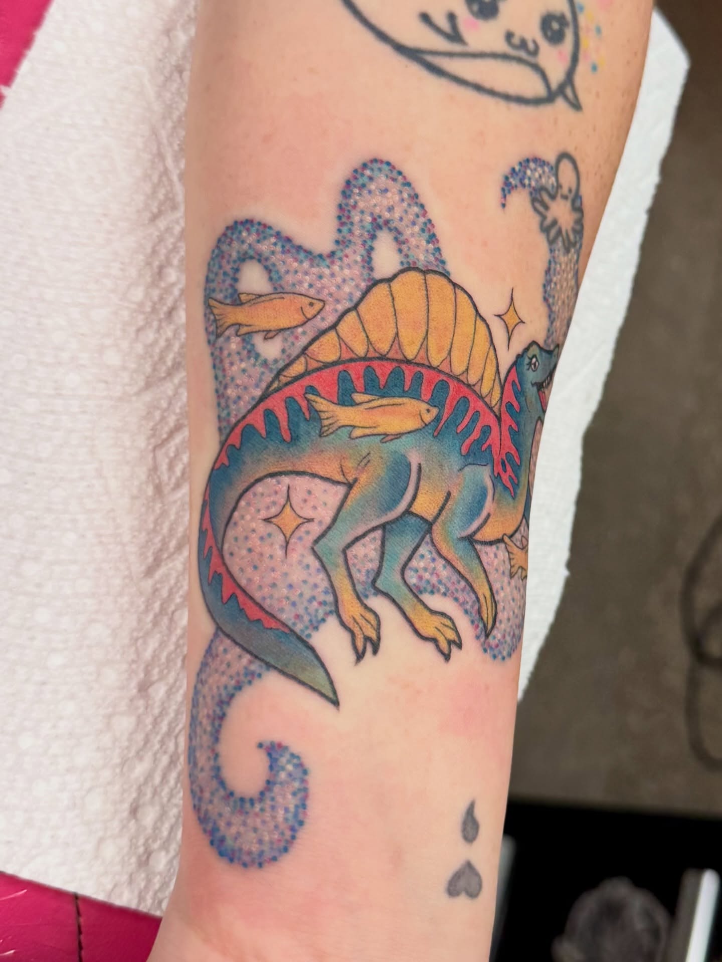 Dinosaur dotwork tattoo on the forearm by Samantha Jane