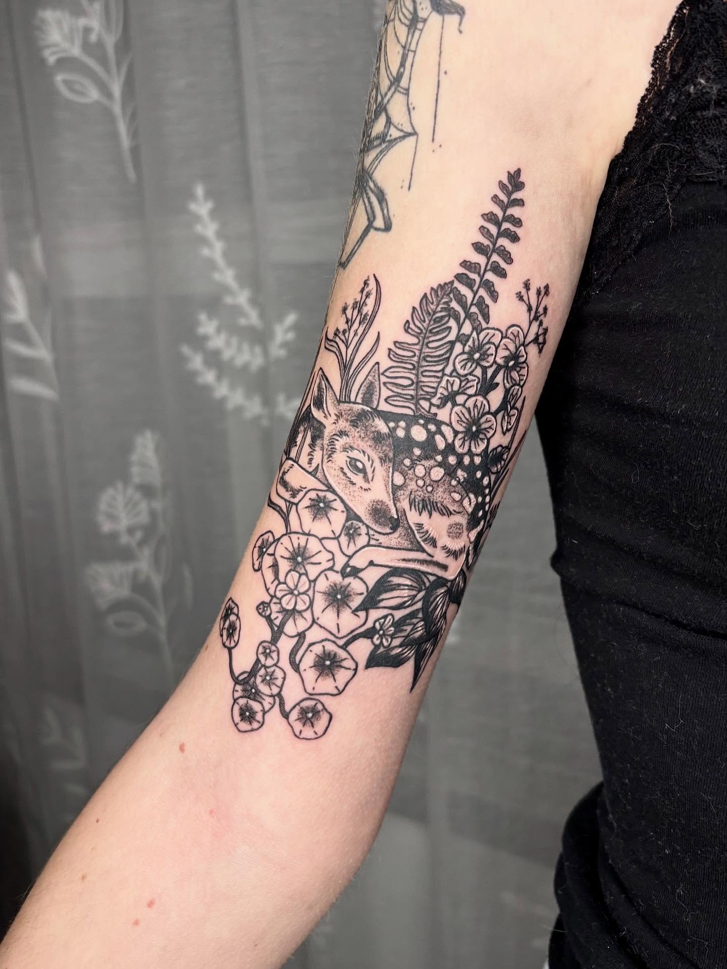 Deer and floral dotwork tattoo on the forearm by destiney rose