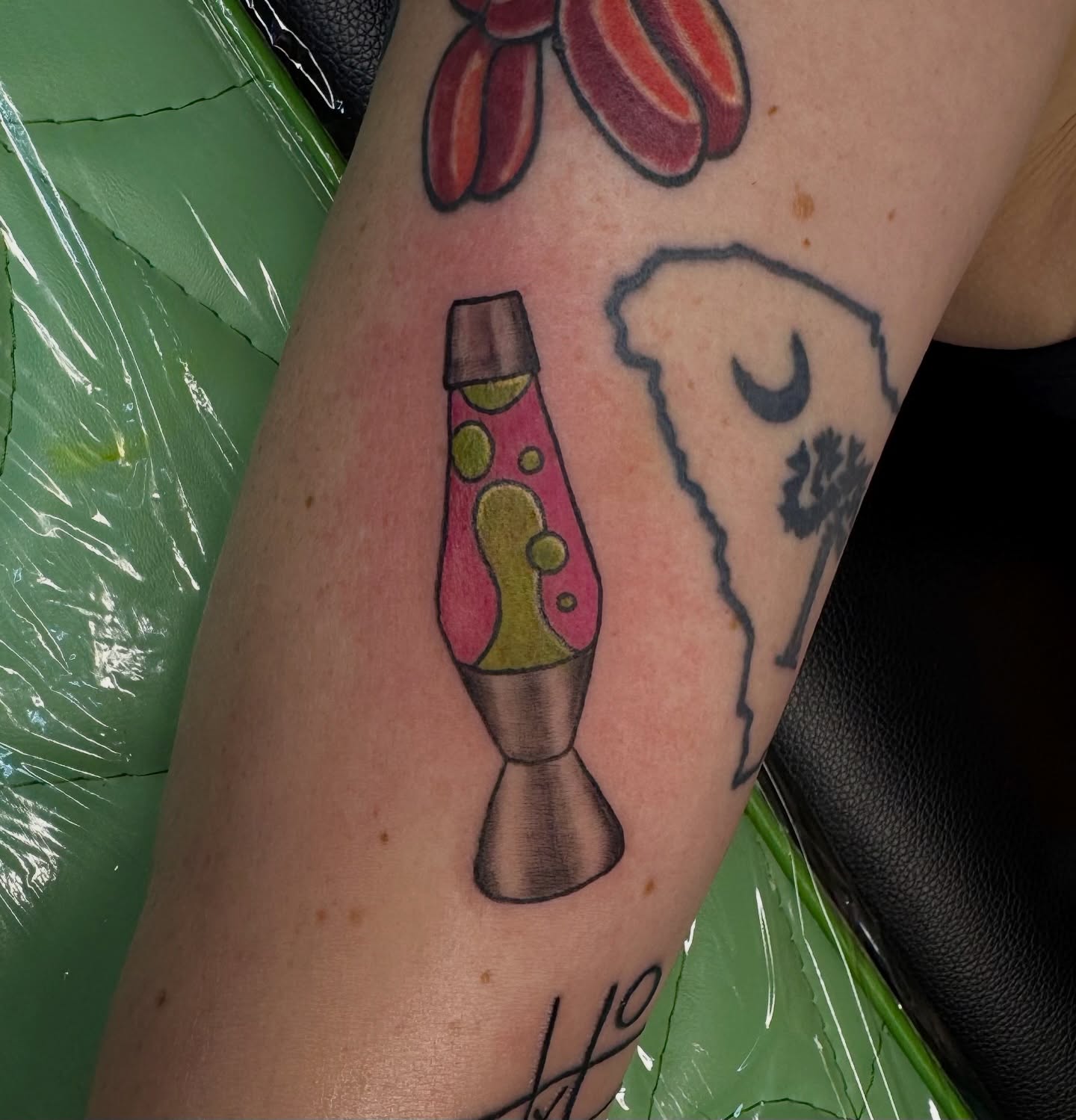 Lava lamp new school tattoo on the forearm by Minxxy Tattoos