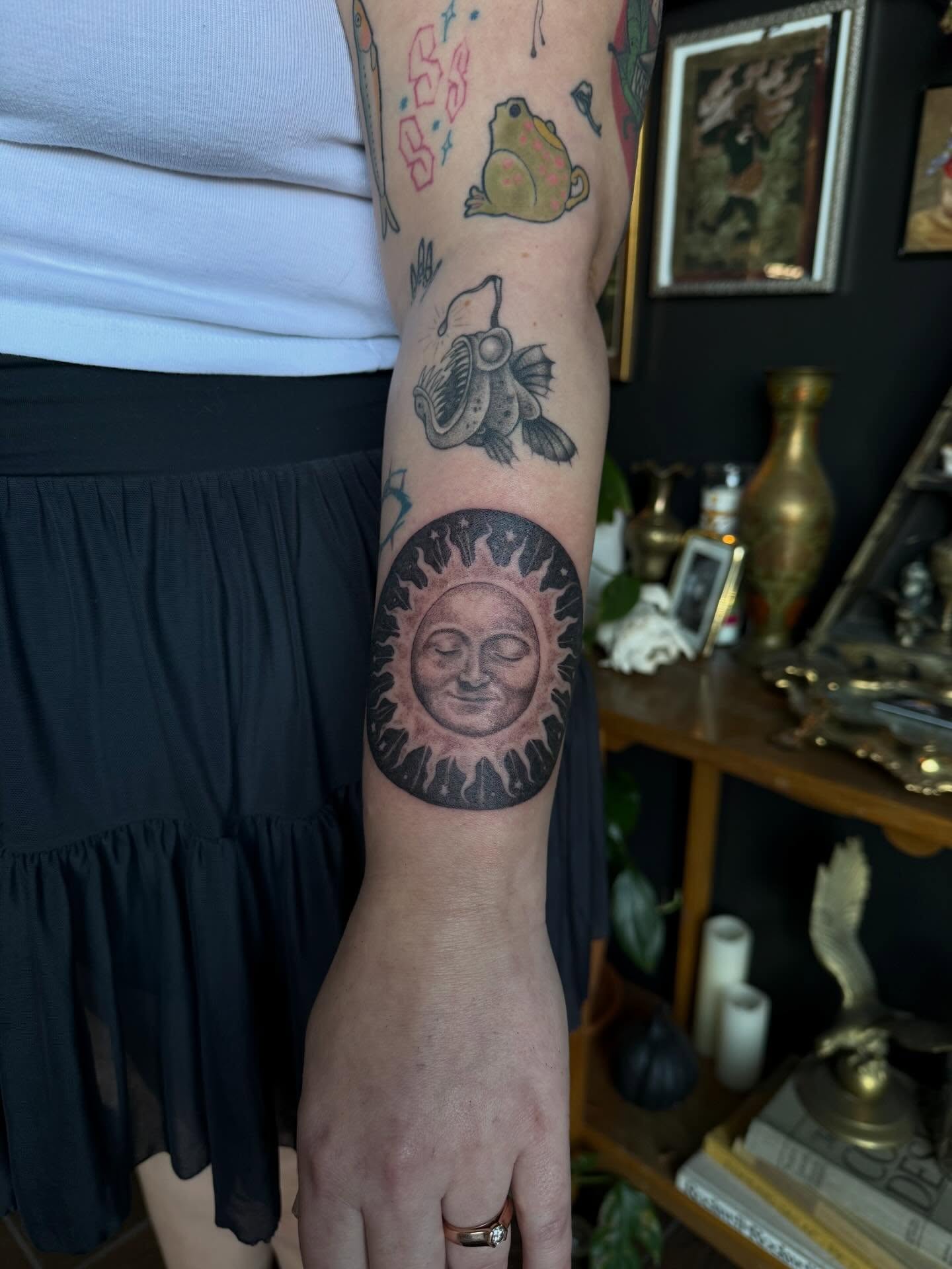 Sun with face black and grey tattoo on the forearm by Cort Prescott 🕸 OKC Tattoo Artist, Oklahoma City, Oklahoma