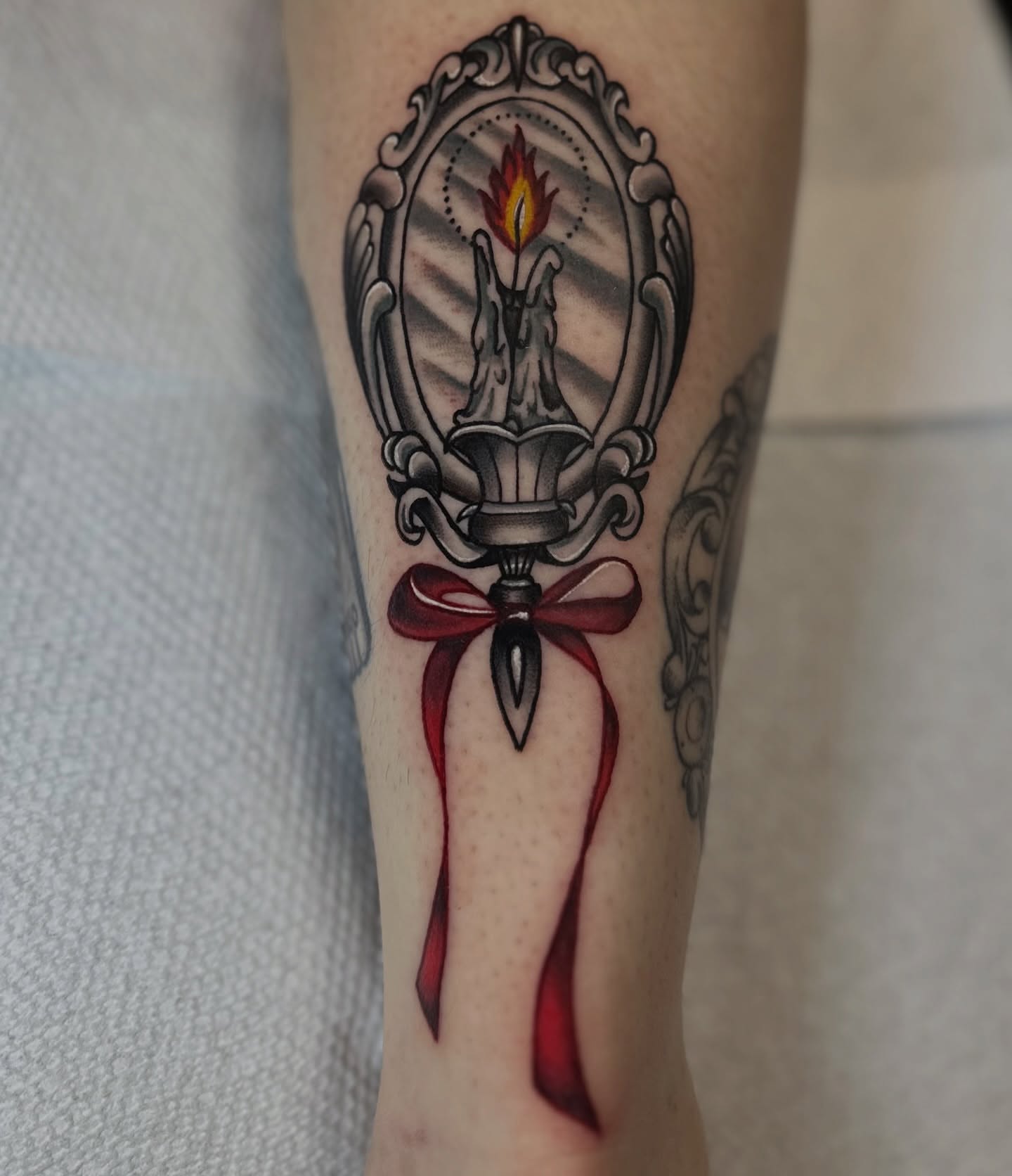 Candle with ribbon black and grey tattoo on the forearm by Nick Weaver aka gibby sometimes gilbert