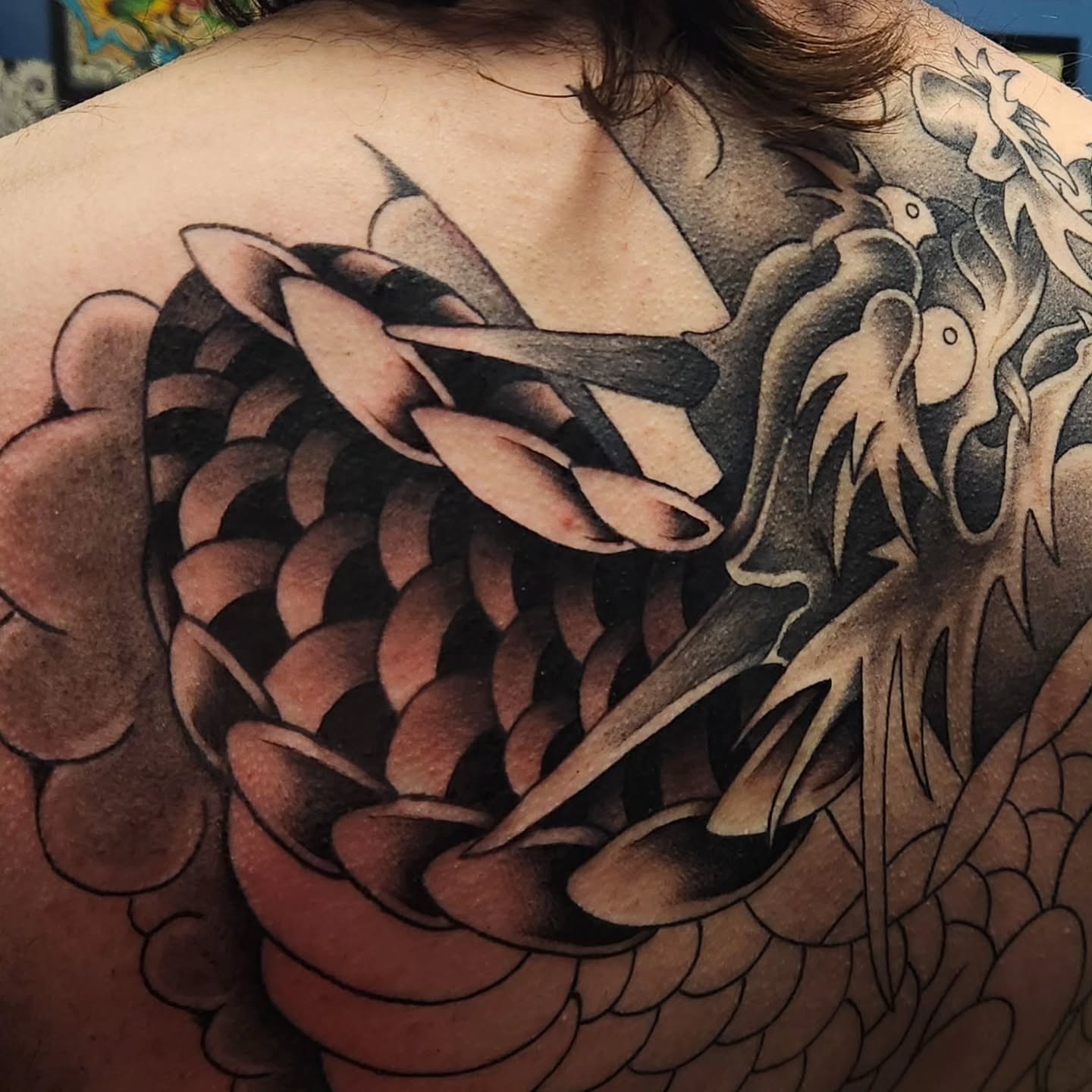 Dragon black and grey tattoo on the back by Gavvo
