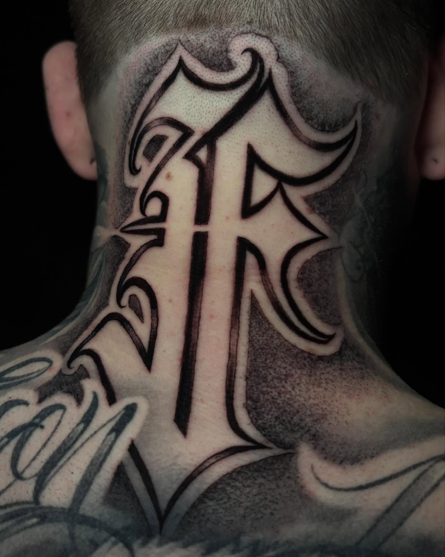 Cross black and grey tattoo on the neck by Trusty Dizon Tattoo Artist