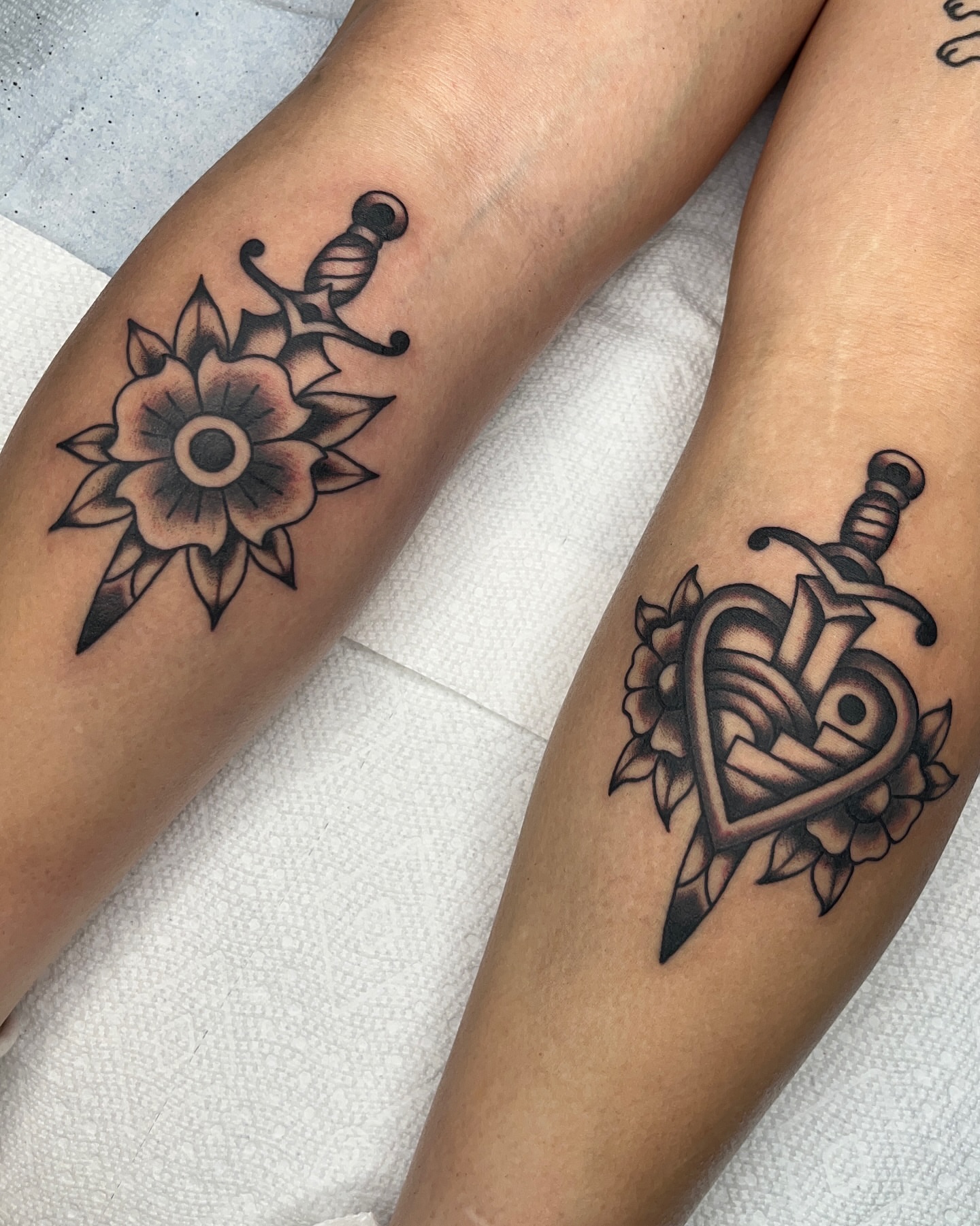Flower and sword black and grey tattoo on the forearm by Nat Power